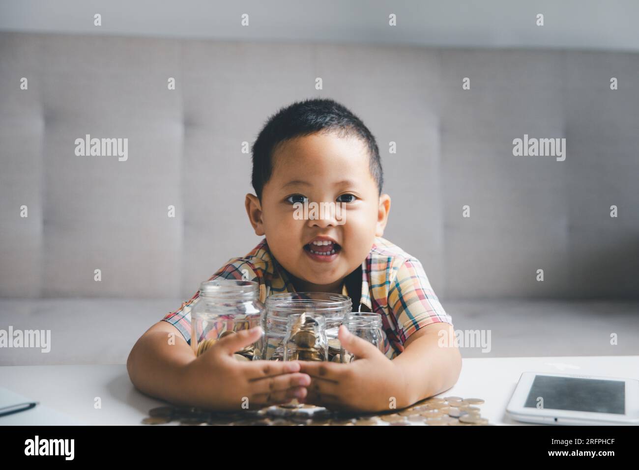 Preschooler child learning to calculate personal budget, manage finance