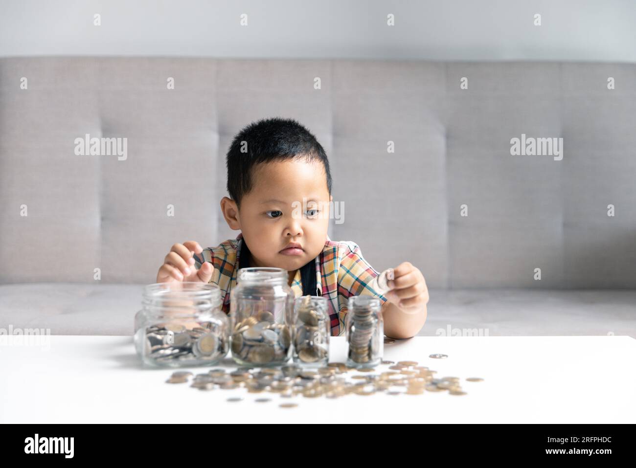 Preschooler child learning to calculate personal budget, manage finance