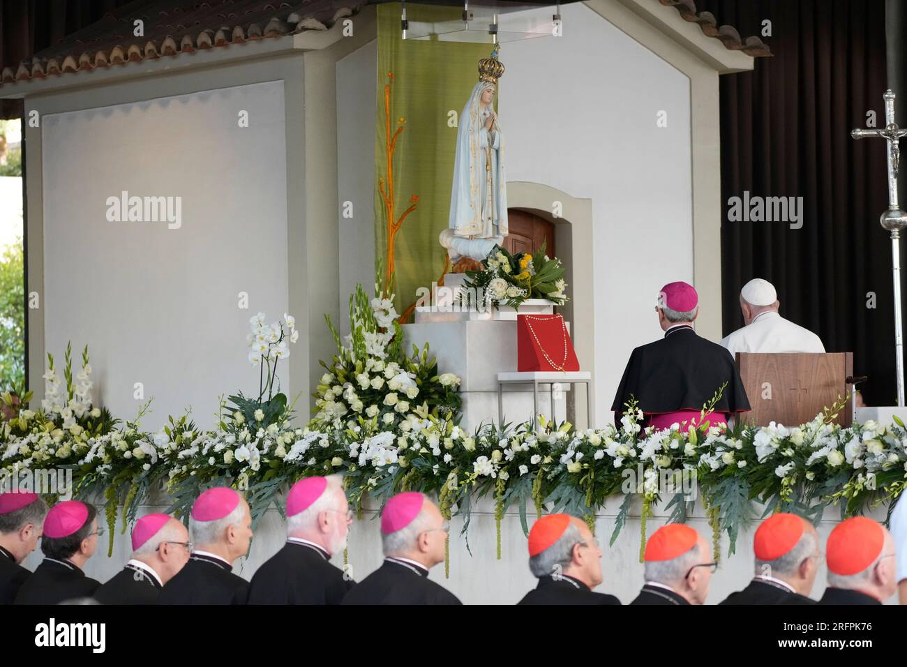 Pope Francis, right, flanked by Bishop Diego Ravelli, prays at the ...