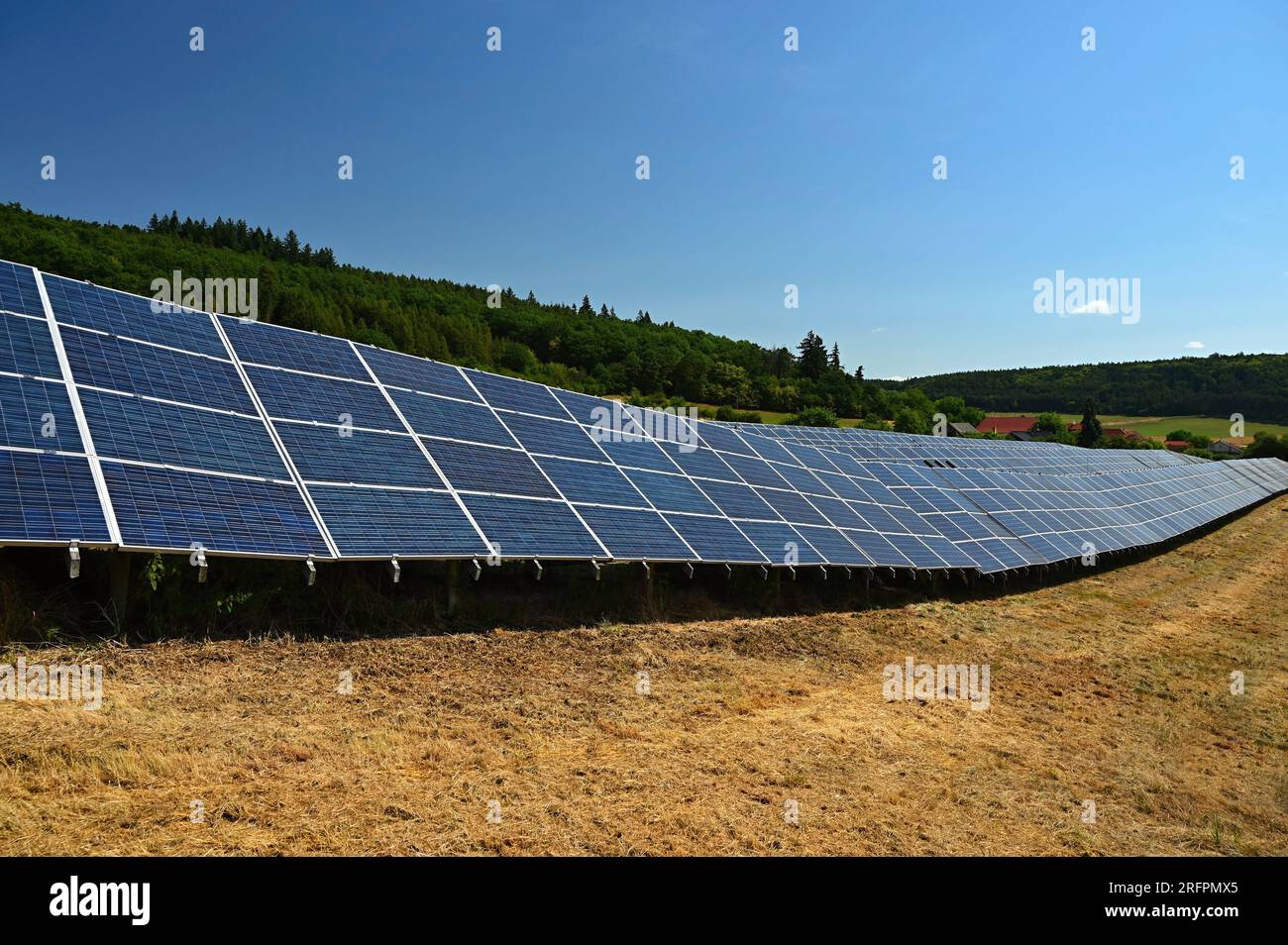Solar power plant - concept for electricity and ecological industry. High energy prices. Beautiful landscape and sunny day with blue sky. Photovoltaic Stock Photo