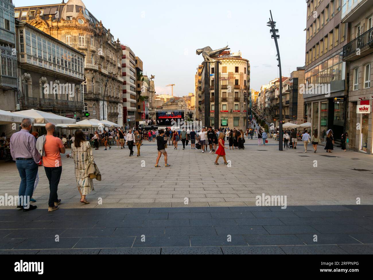 People in pedestrianised central square, Praza Porto do Sol plaza, city centre of Vigo, Galicia, Spain Stock Photo