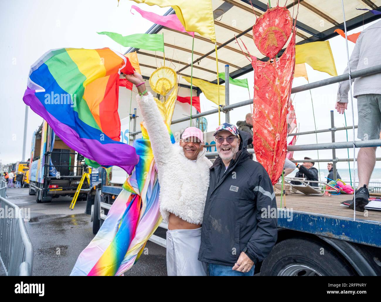 Brighton UK 5th August 2023 - Early arrivals brave the wind and rain at Brighton & Hove Pride Parade which  is  part of the largest  Pride festival events in the UK . Revellers brave the weather as Storm Antoni bathers part of the UK today    : Credit Simon Dack / Alamy Live News Stock Photo