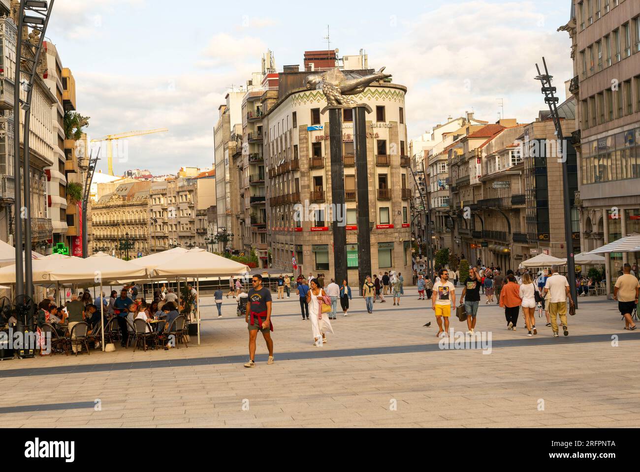People in pedestrianised central square, Praza Porto do Sol plaza, city centre of Vigo, Galicia, Spain Stock Photo