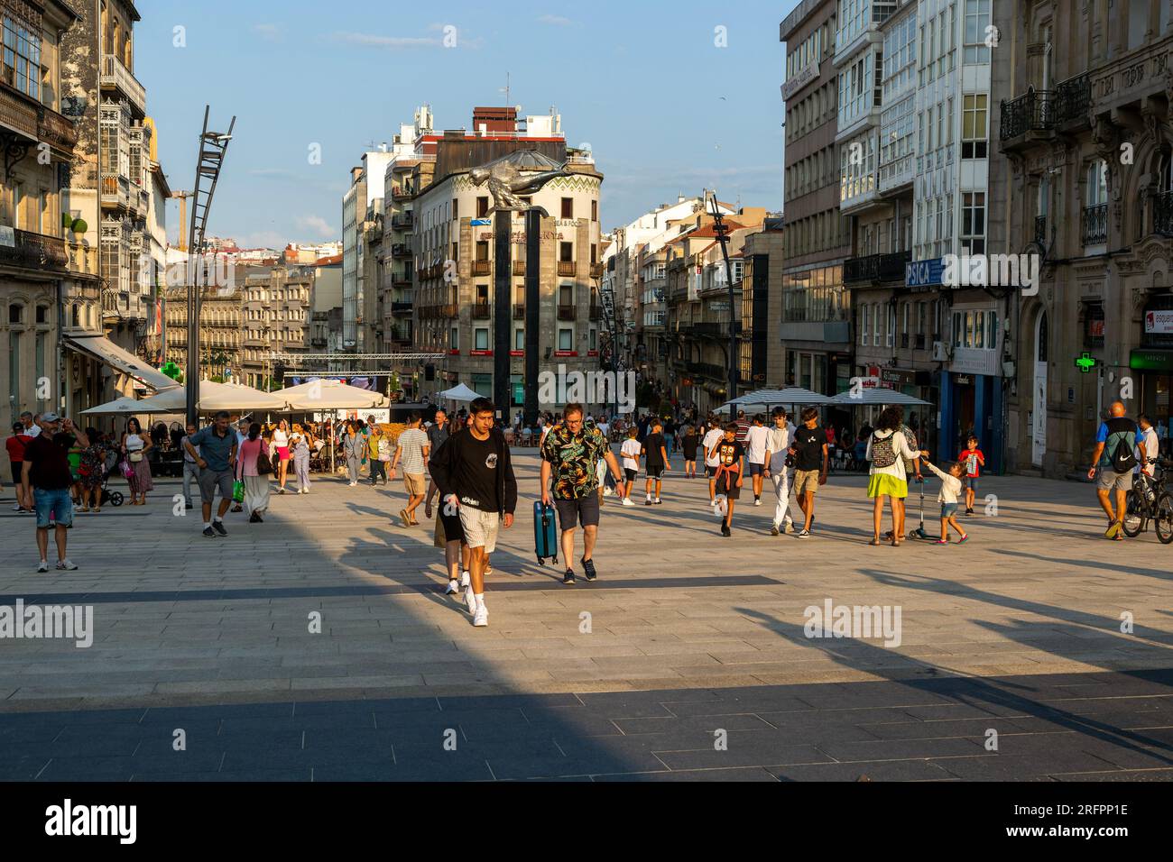 People in pedestrianised central square, Praza Porto do Sol plaza, city centre of Vigo, Galicia, Spain Stock Photo