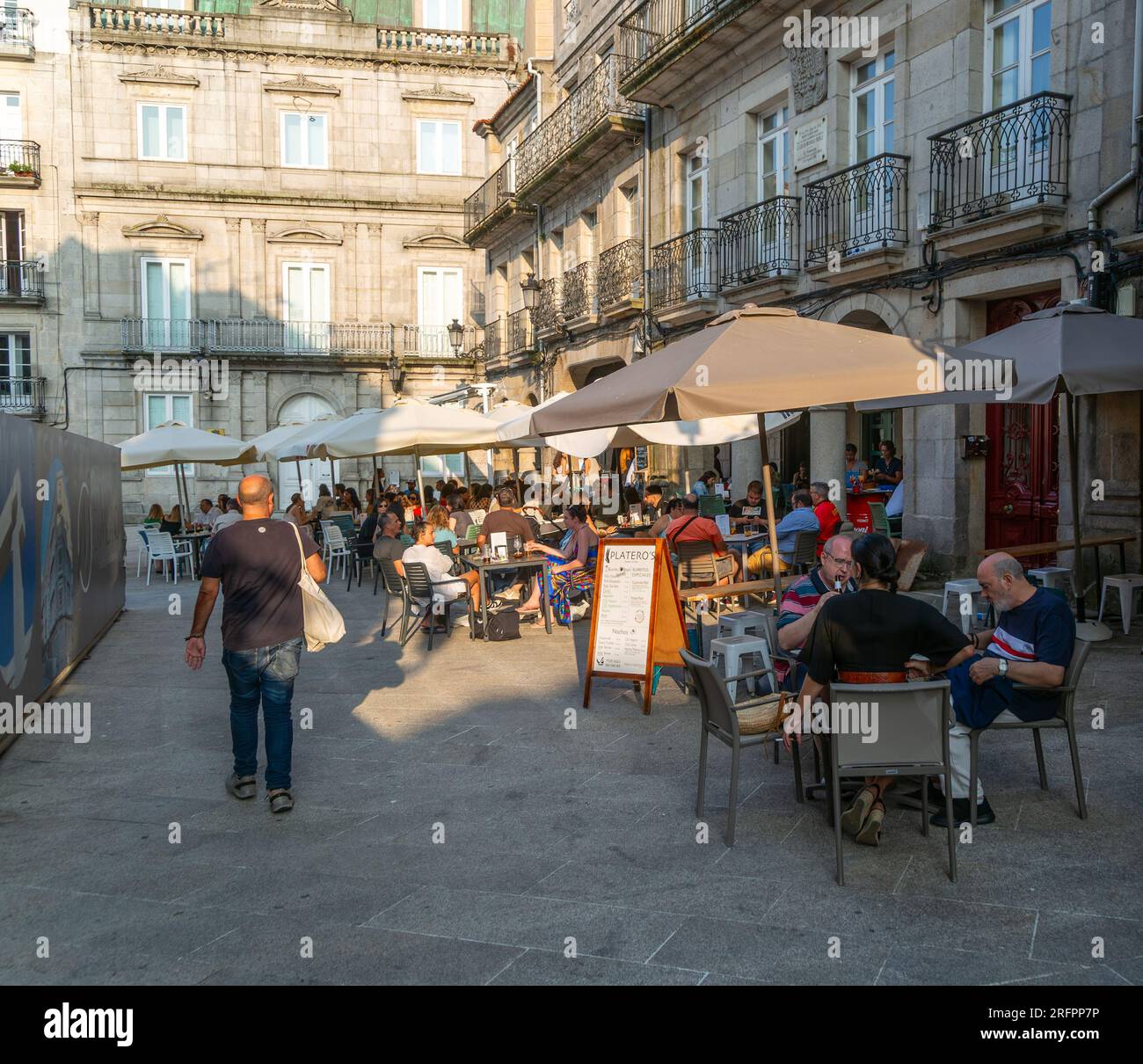 People and street cafes bars, near Plaza de la Constitucion square, old