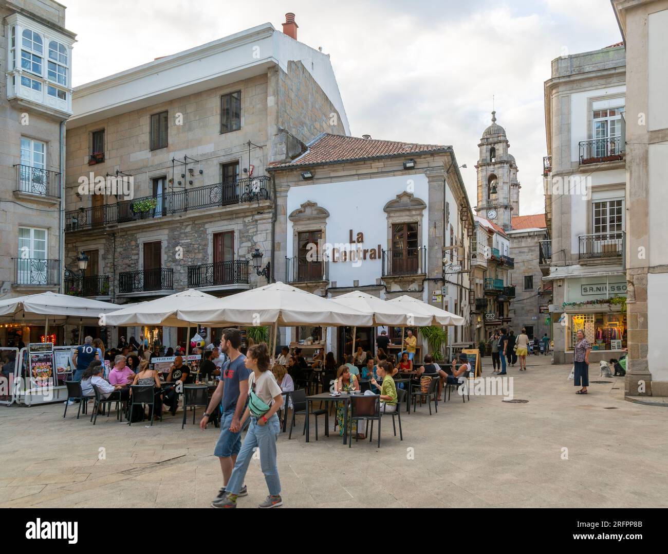 People and street cafes bars, Plaza de la Constitucion square, old town city centre of Vigo, Galicia, Spain Stock Photo