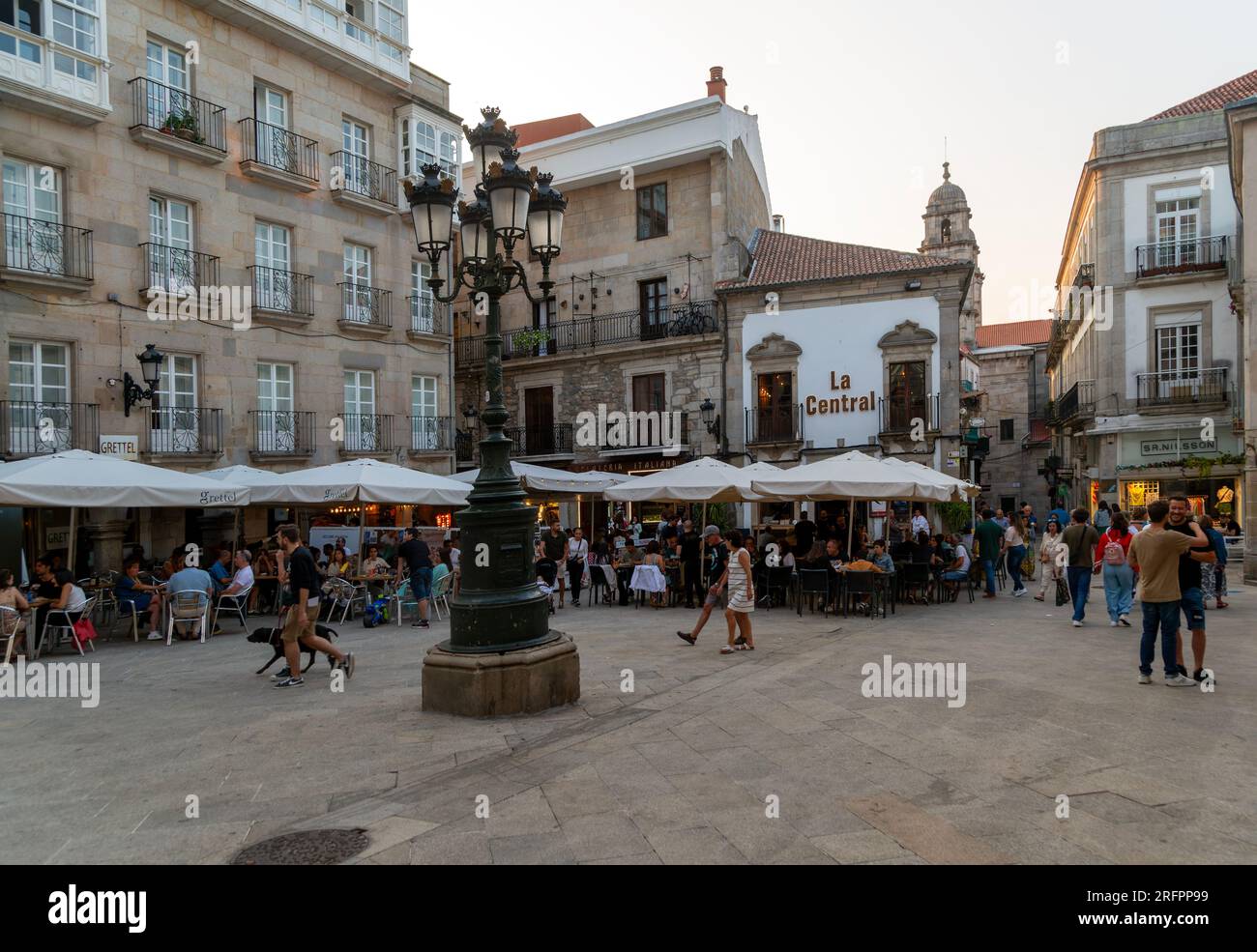 People and street cafes bars, near Plaza de la Constitucion square, old