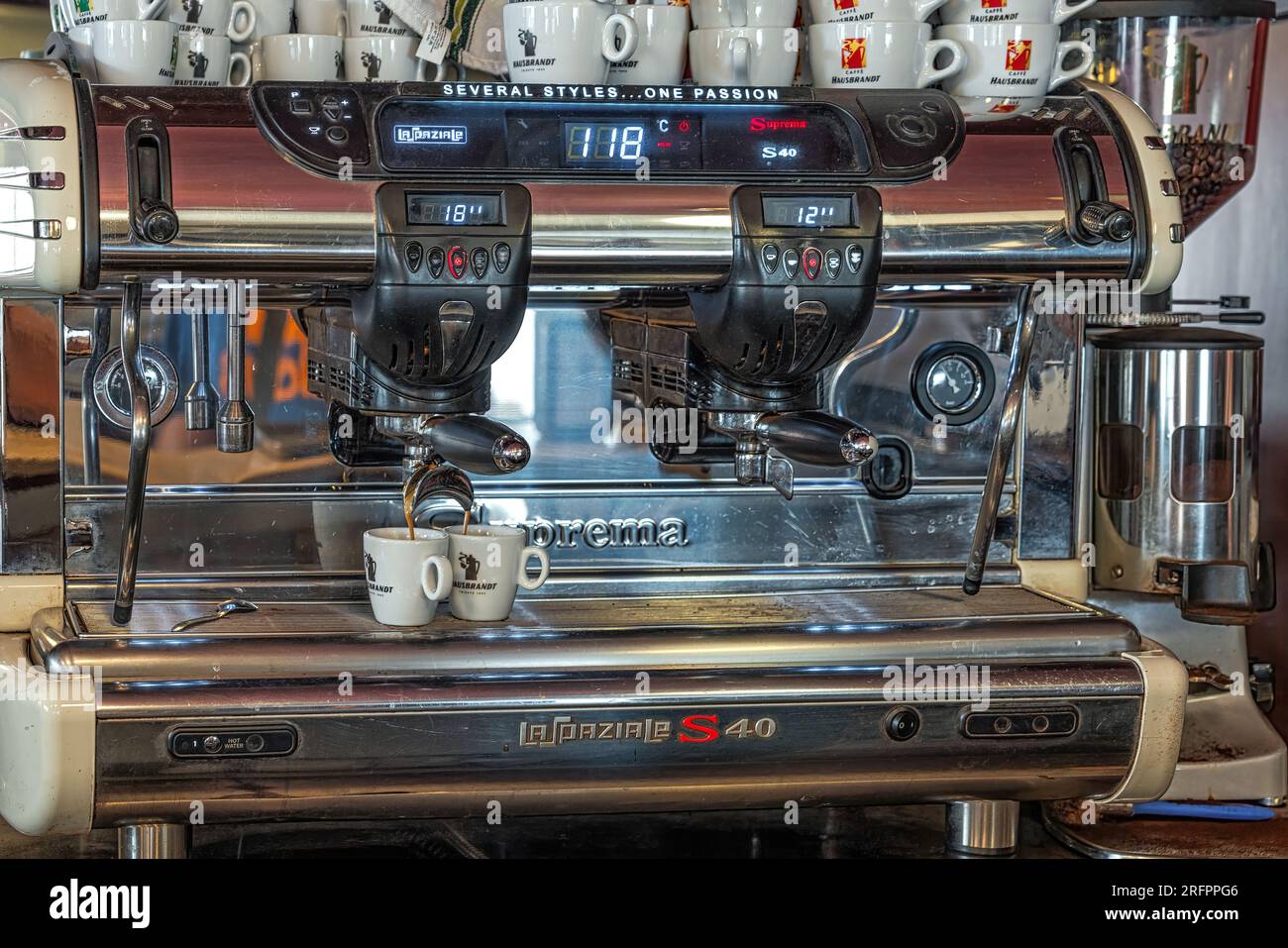 espresso machine makingv two coffee cups in a bar, Italy Stock Photo
