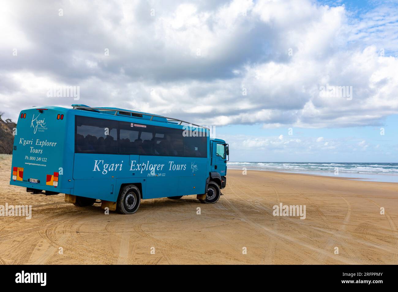 Fraser Island K'gari explorer tour bus driving along 75 mile beach which is  a legal road, for tourists to visit sights, Queensland,Australia,2023 Stock  Photo - Alamy