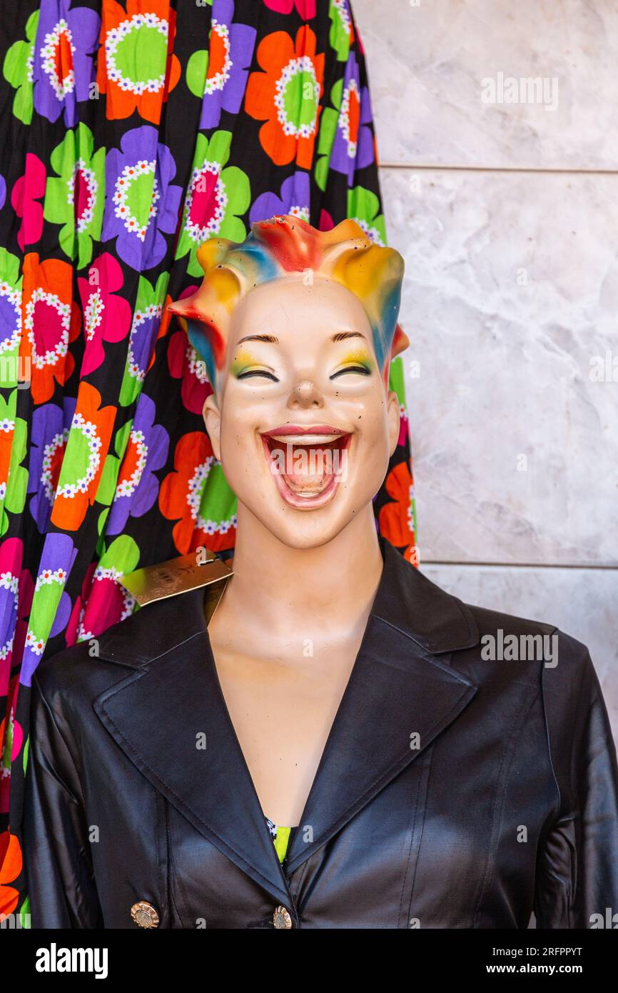 At the entrance to a clothing store, a hilarious mannequin welcoming customers. Jinja, Uganda. Stock Photo