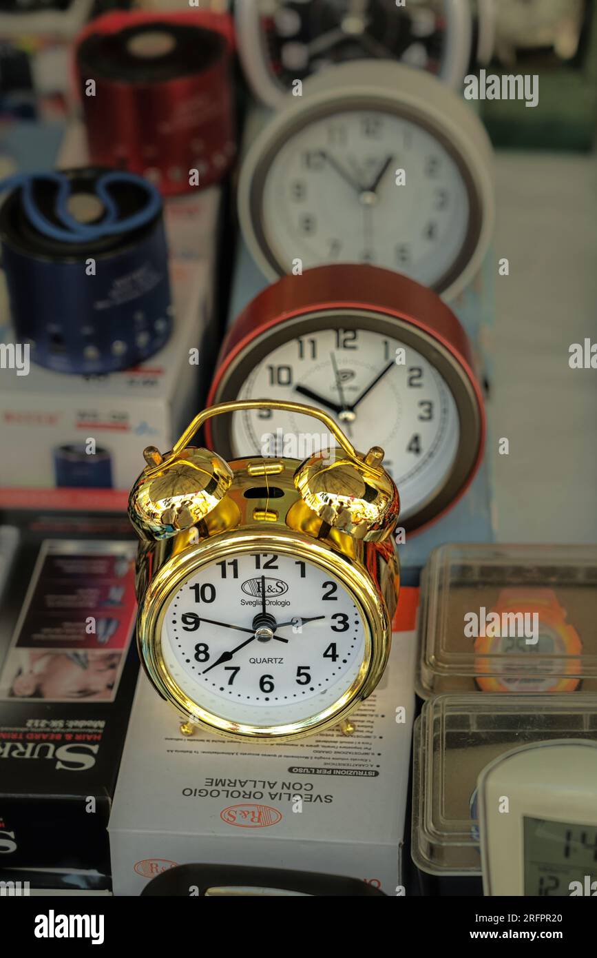 seller of alarm clocks at market Stock Photo - Alamy