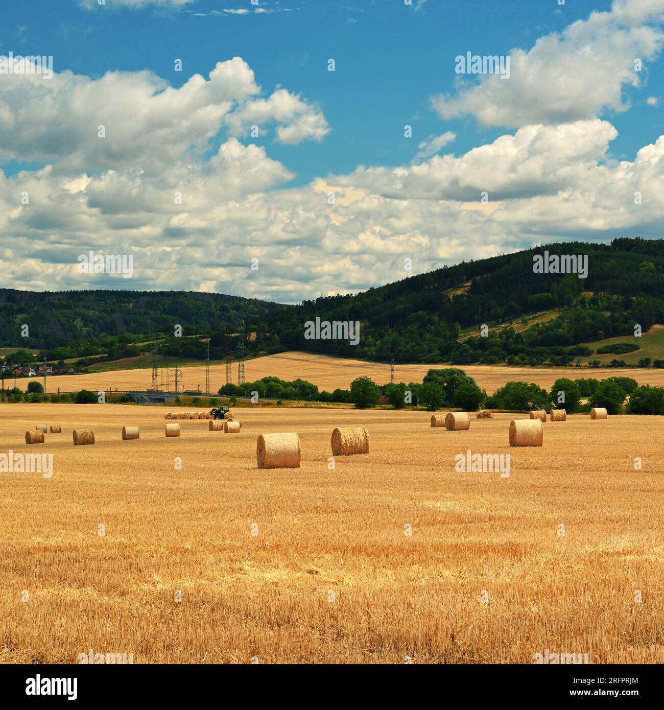 Beautiful countryside landscape. Hay bales in harvested fields. Stock Photo