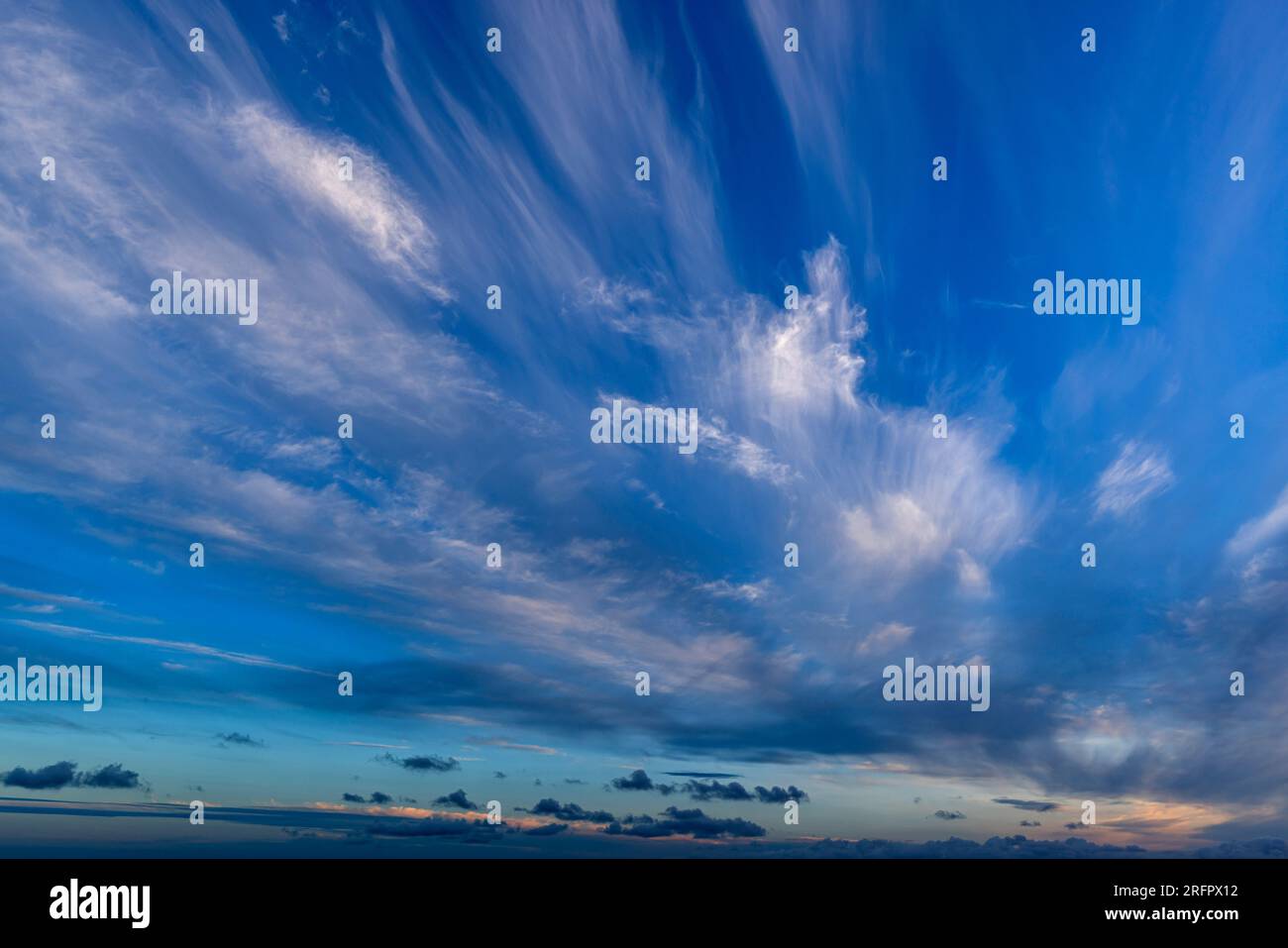 Wispy cirrus clouds against a blue sky Stock Photo - Alamy