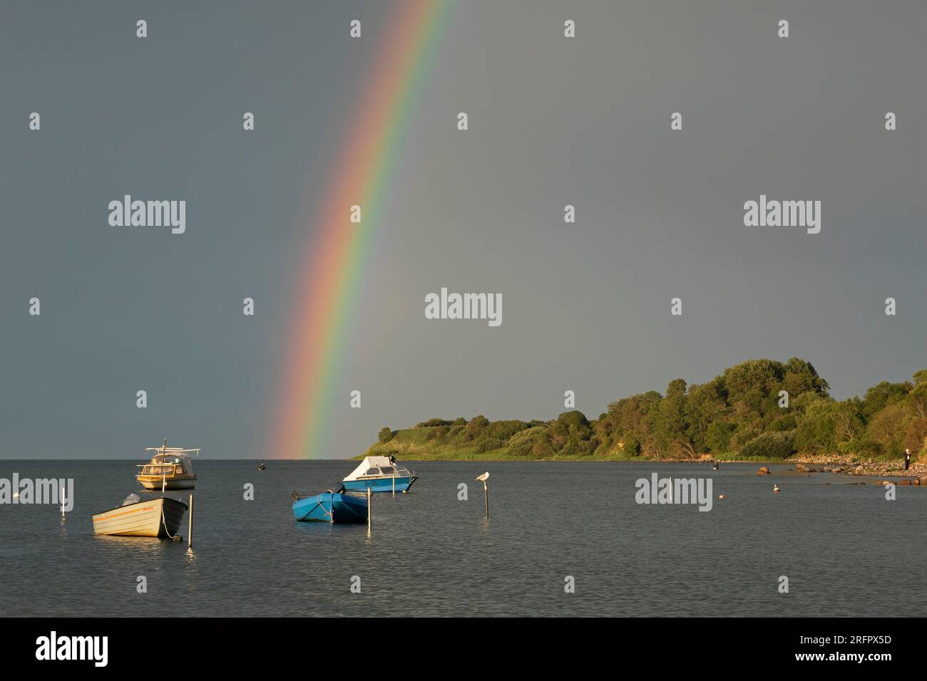 Rainbow above Baltic Sea, boats, Habernis, Steinberg, Schleswig-Holstein, Germany Stock Photo