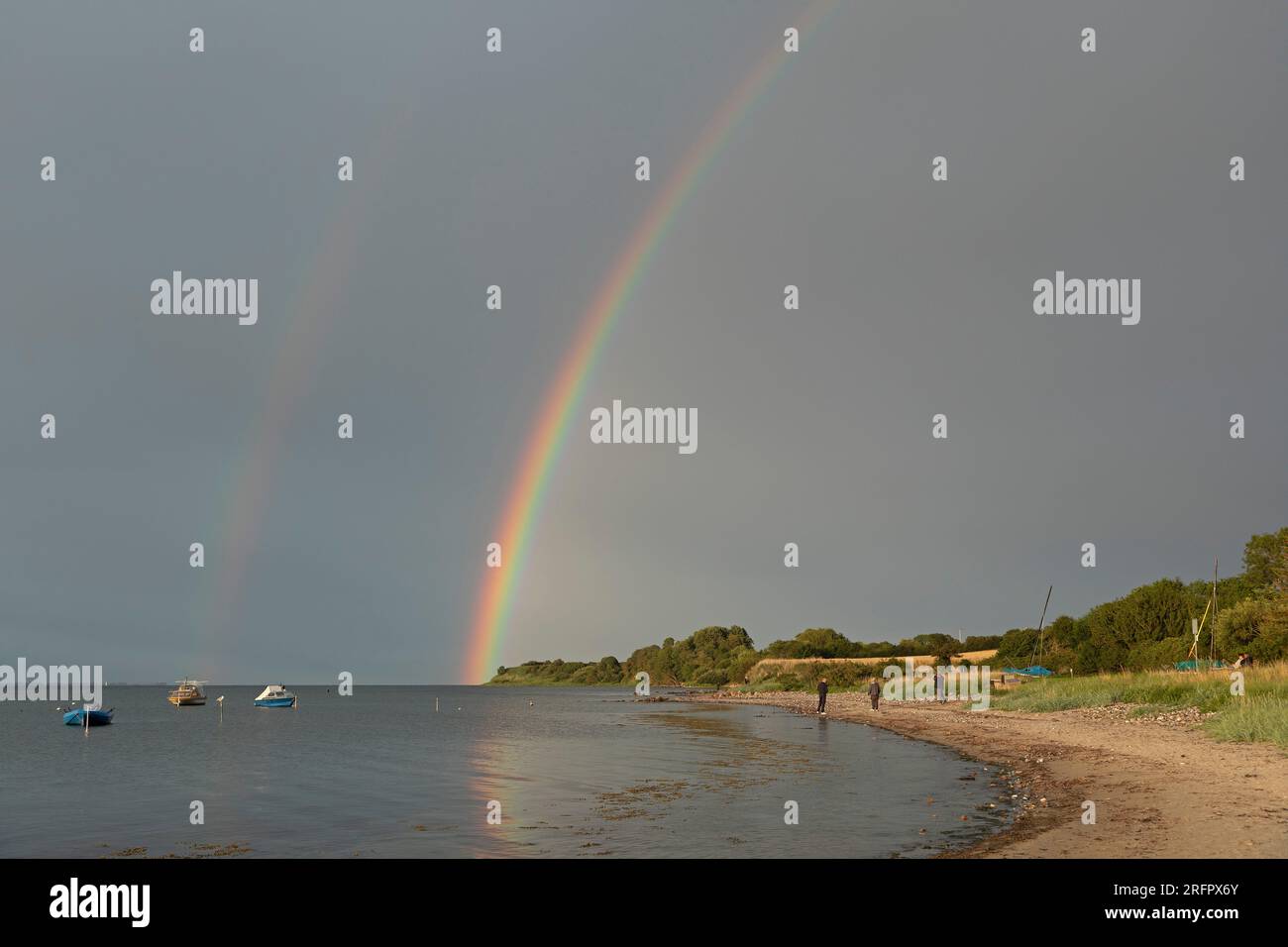 Rainbow above Baltic Sea, boats, beach, Habernis, Steinberg, Schleswig-Holstein, Germany Stock Photo