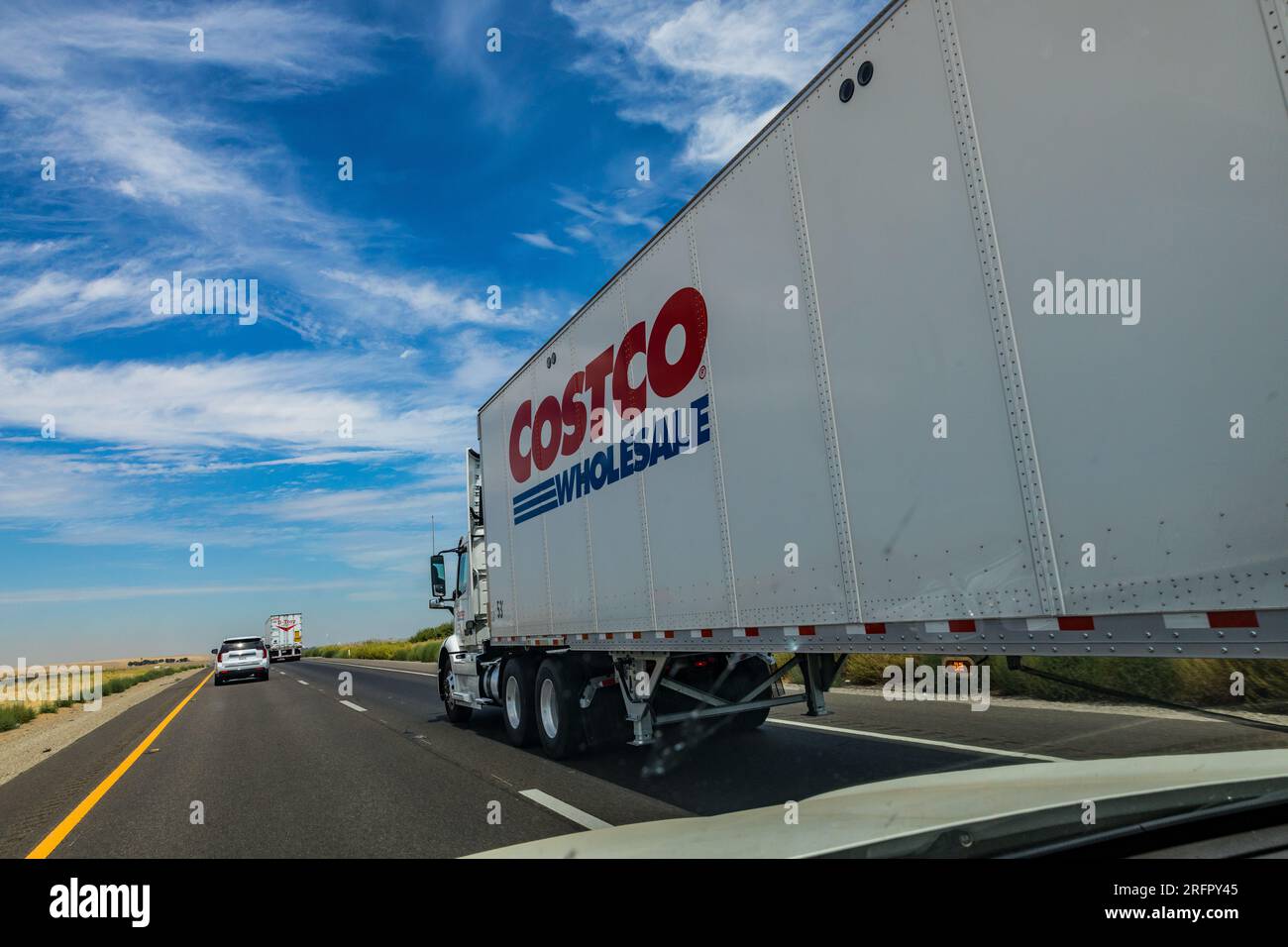 A Costco tractor trailer rolls north on Interstate 5 in the Central Valley of California USA Stock Photo