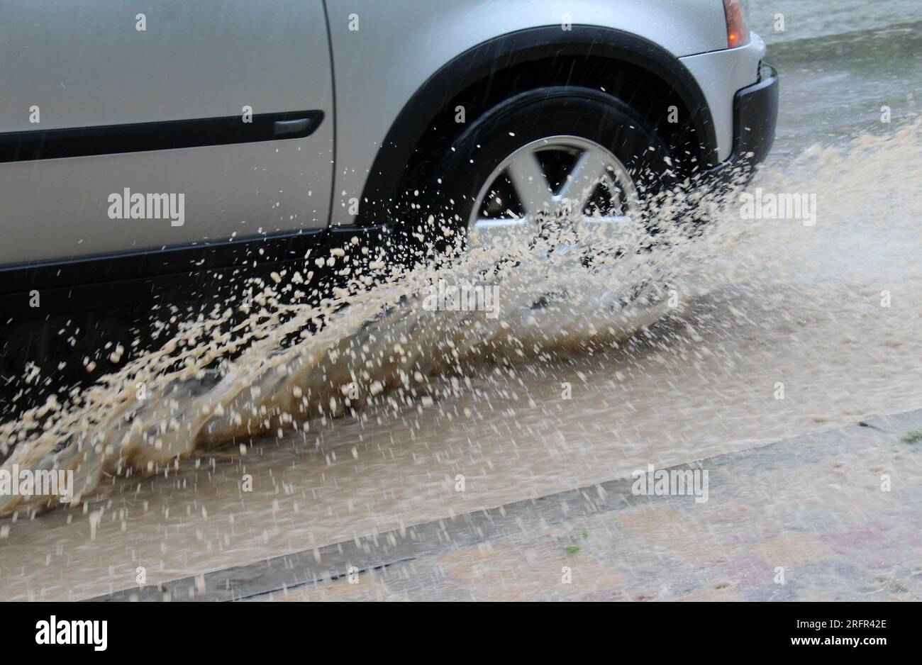 Car wheels in water during heavy rain Stock Photo Alamy