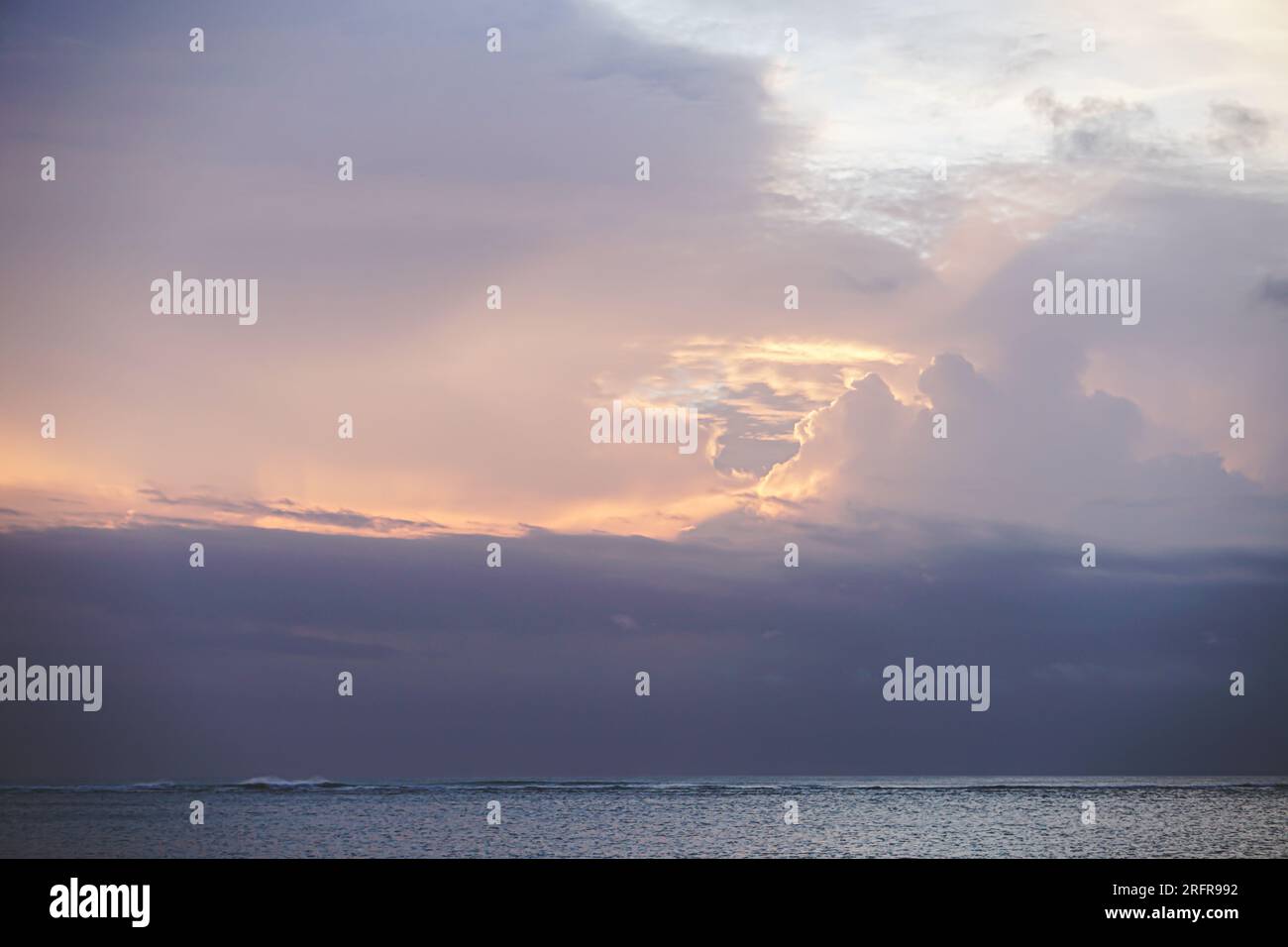 Stormy sky with dramatic clouds from an approaching thunderstorm at sunset Stock Photo