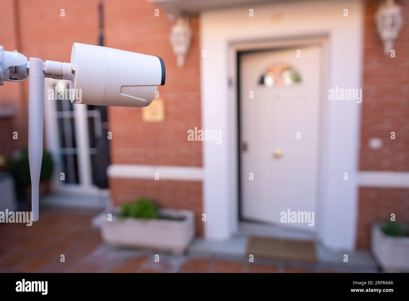 Security camera installed in the garden of a house for the surveillance