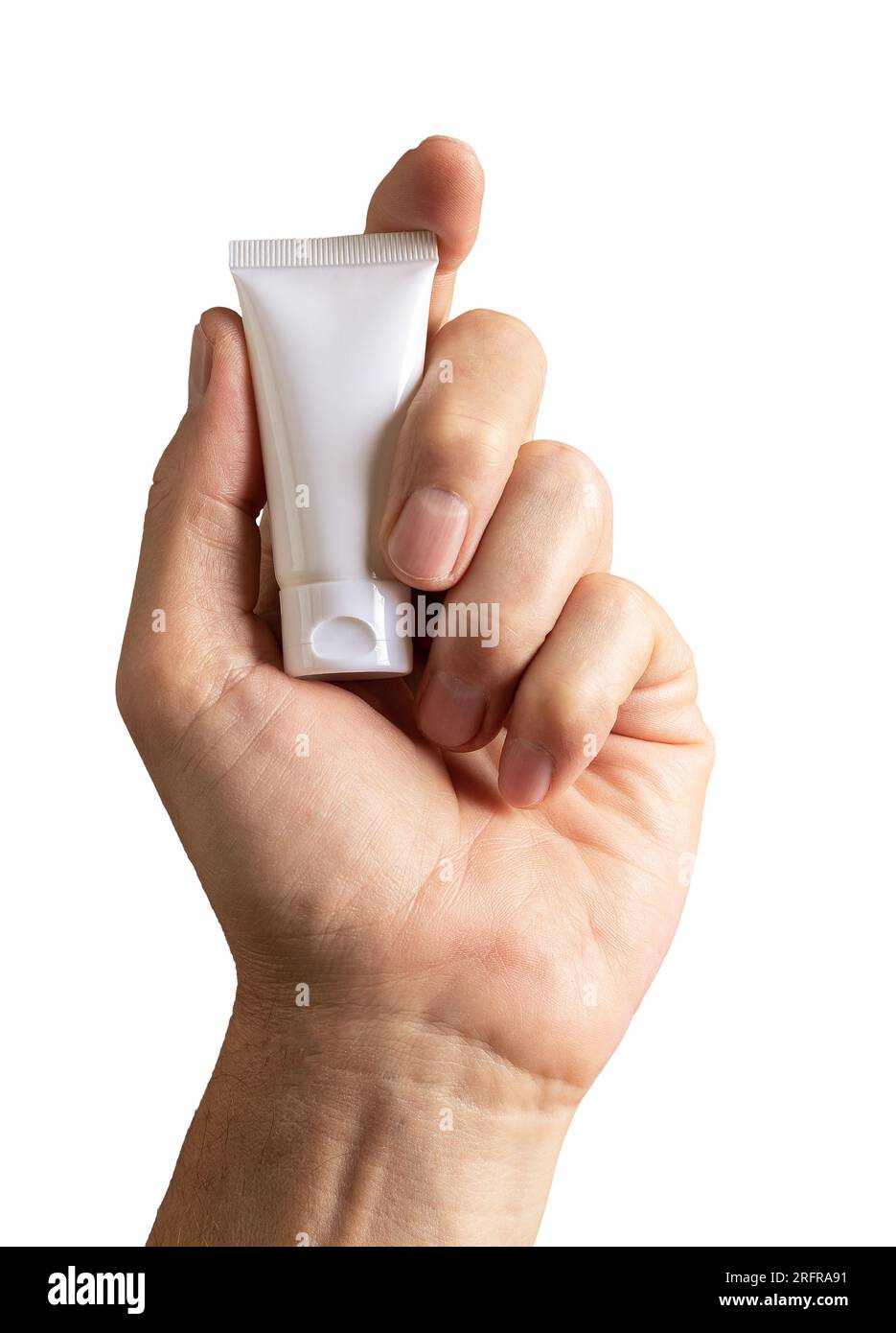 Male hand holding little cream sample, tube mock up, blank package ...