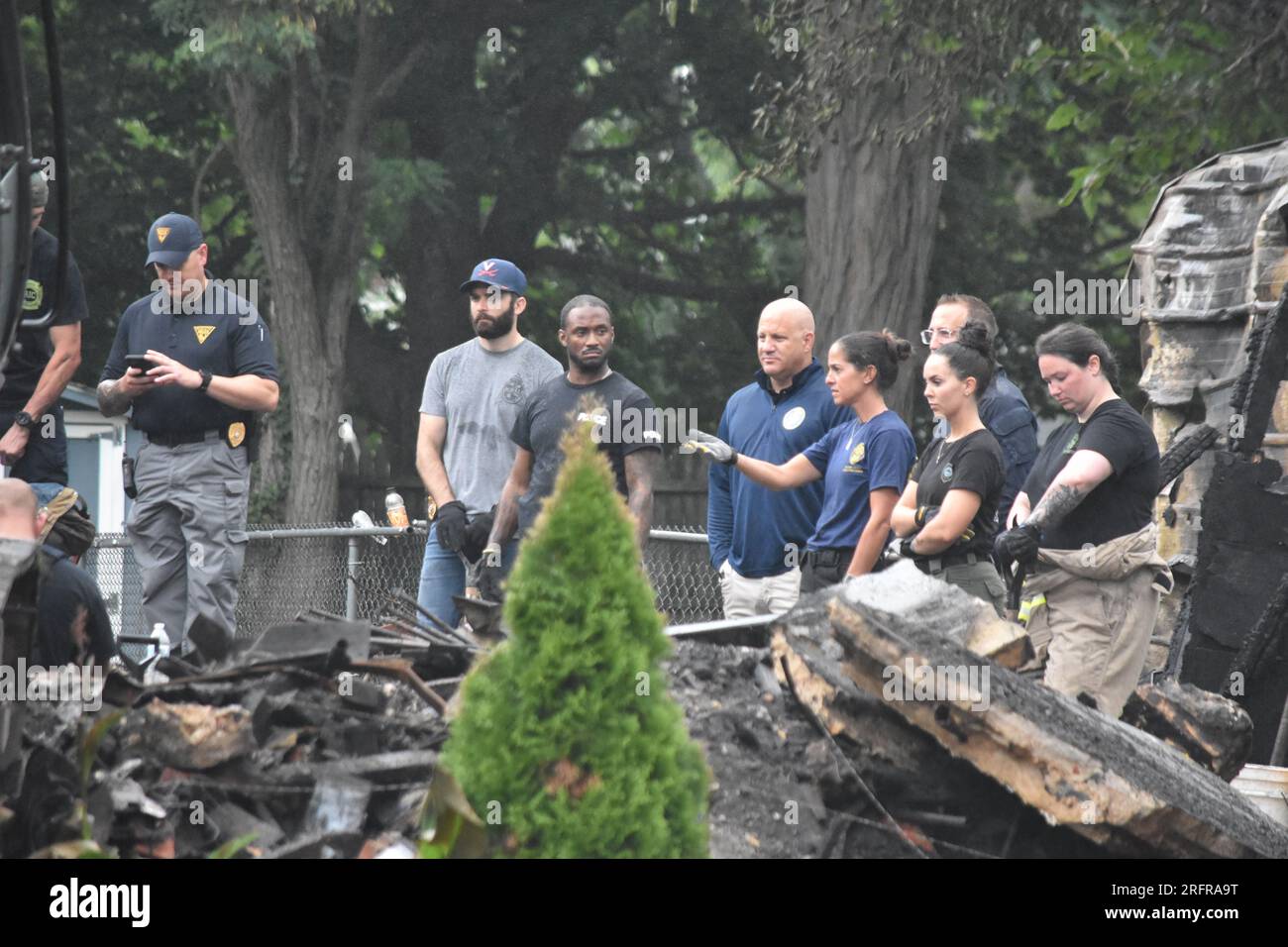 Investigators search in the rubble and debris for the bodies of those ...