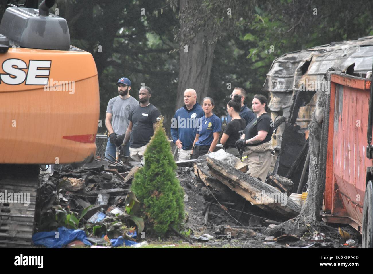 Investigators search in the rubble and debris for the bodies of those ...