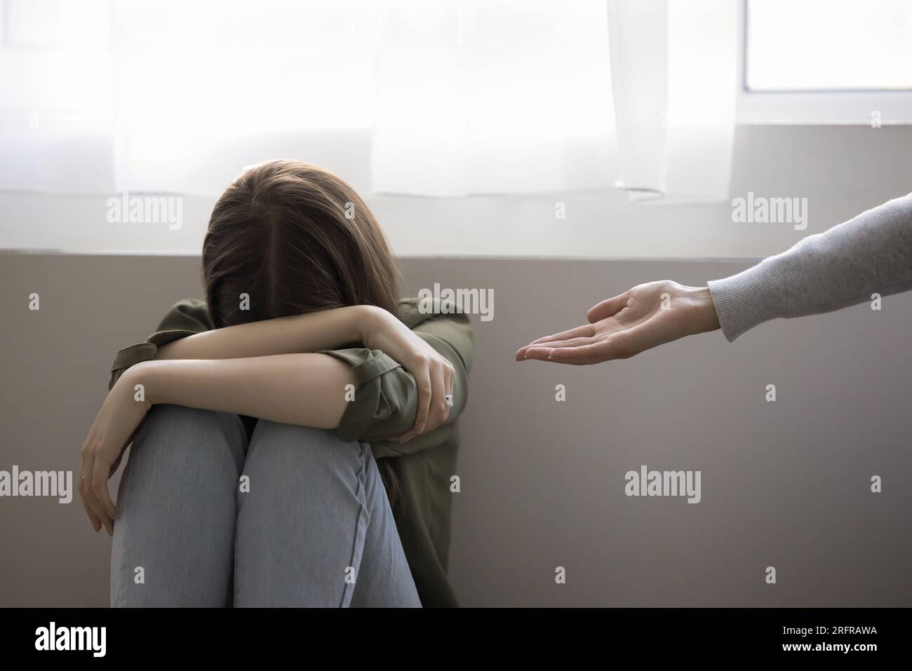 Help Crying Adult woman giving helping hand to crying teenager girl Stock Photo - Alamy