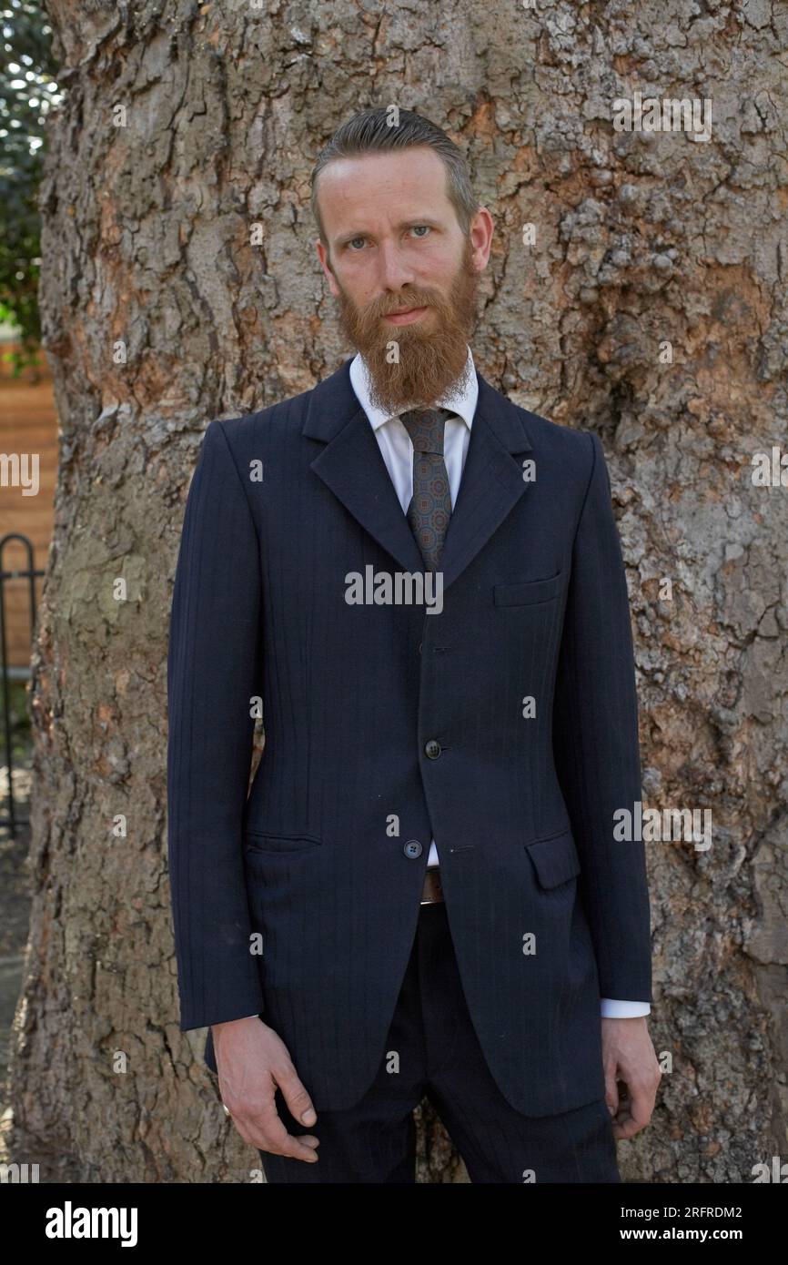 bearded man in suit outdoors. Stock Photo