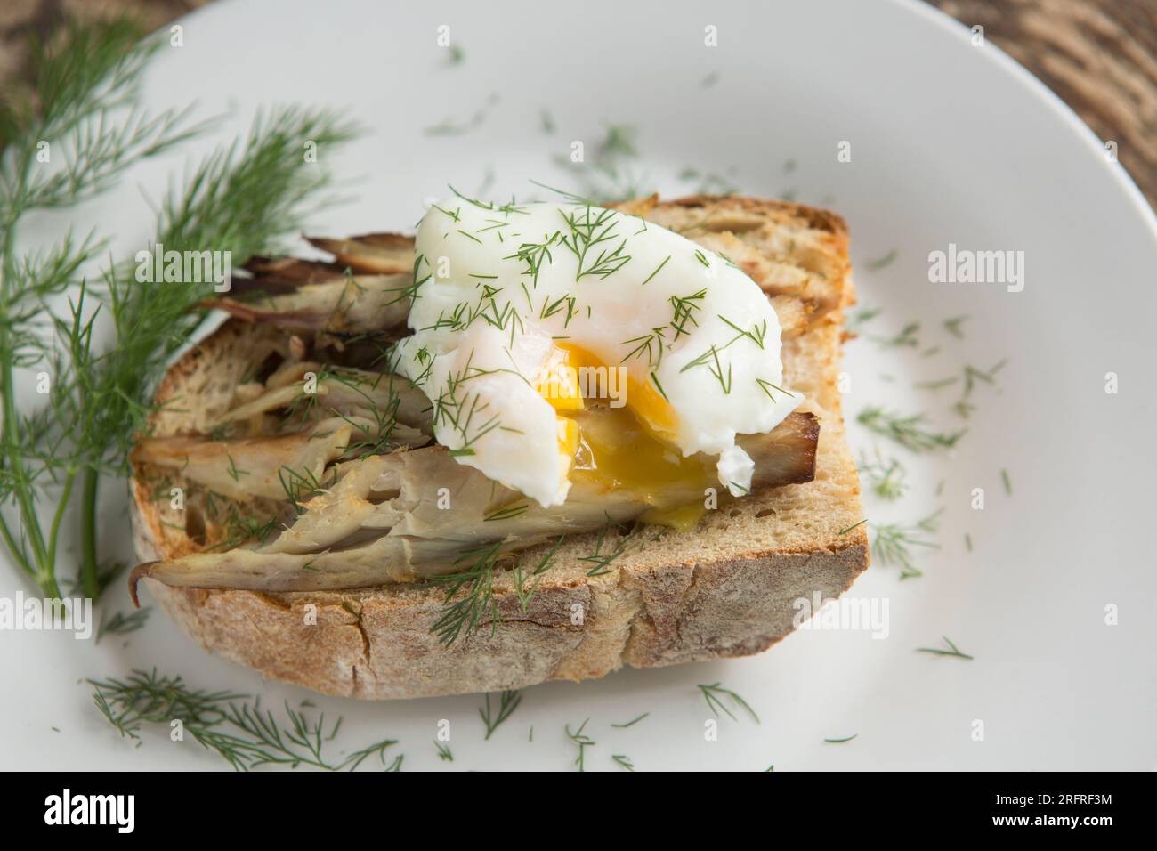 Hot smoked mackerel, served on buttered, toasted sourdough bread with a broken