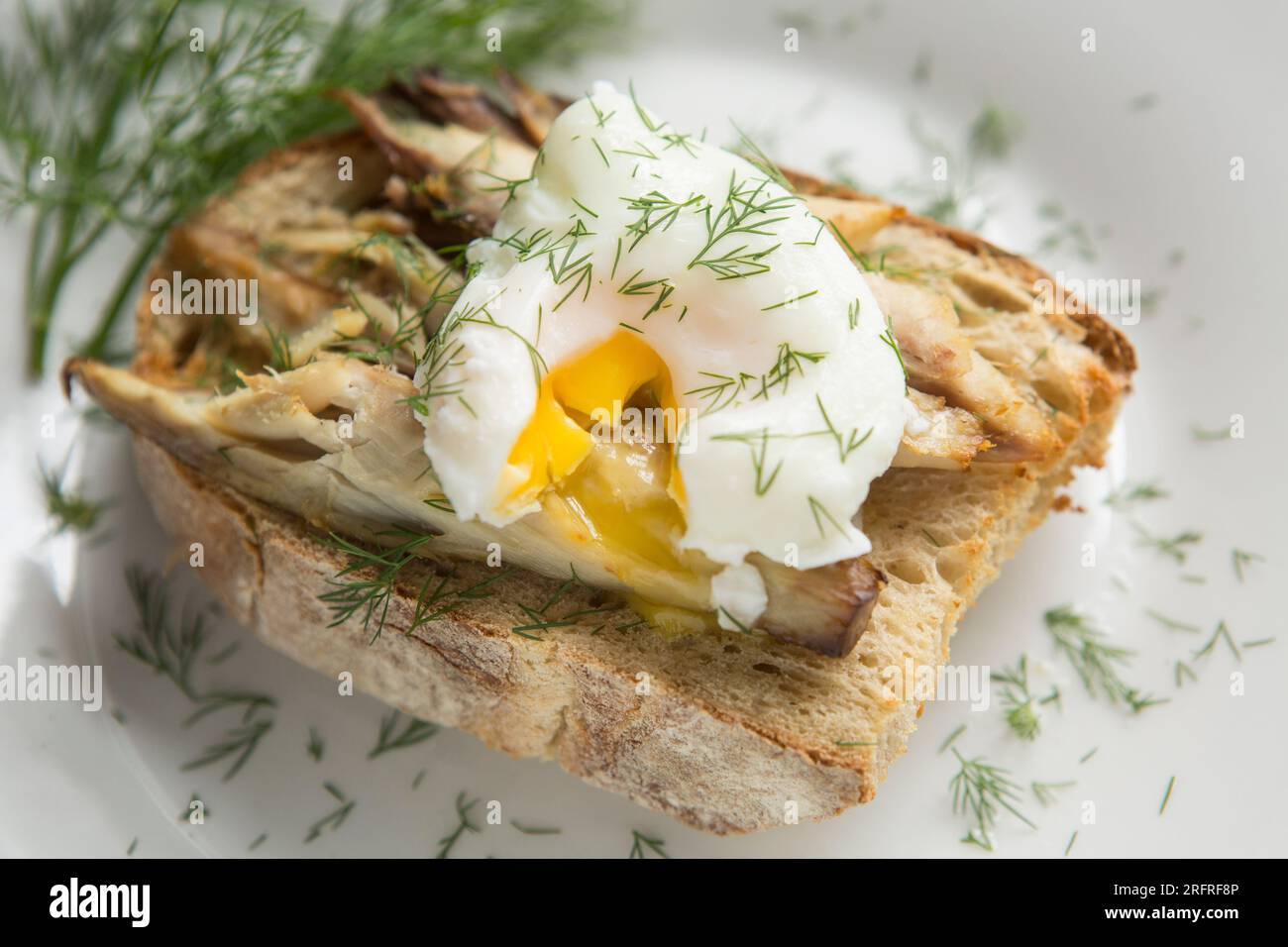 Hot smoked mackerel, served on buttered, toasted sourdough bread with a broken