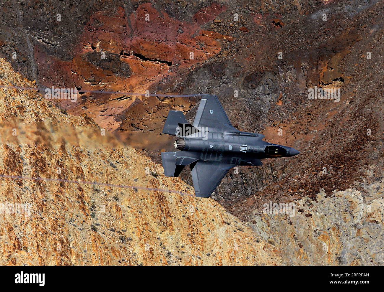 Lockheed Martin F-35 Lightning II passes through Jedi transition in Rainbow Canyon near Death Valley National Park. Stock Photo
