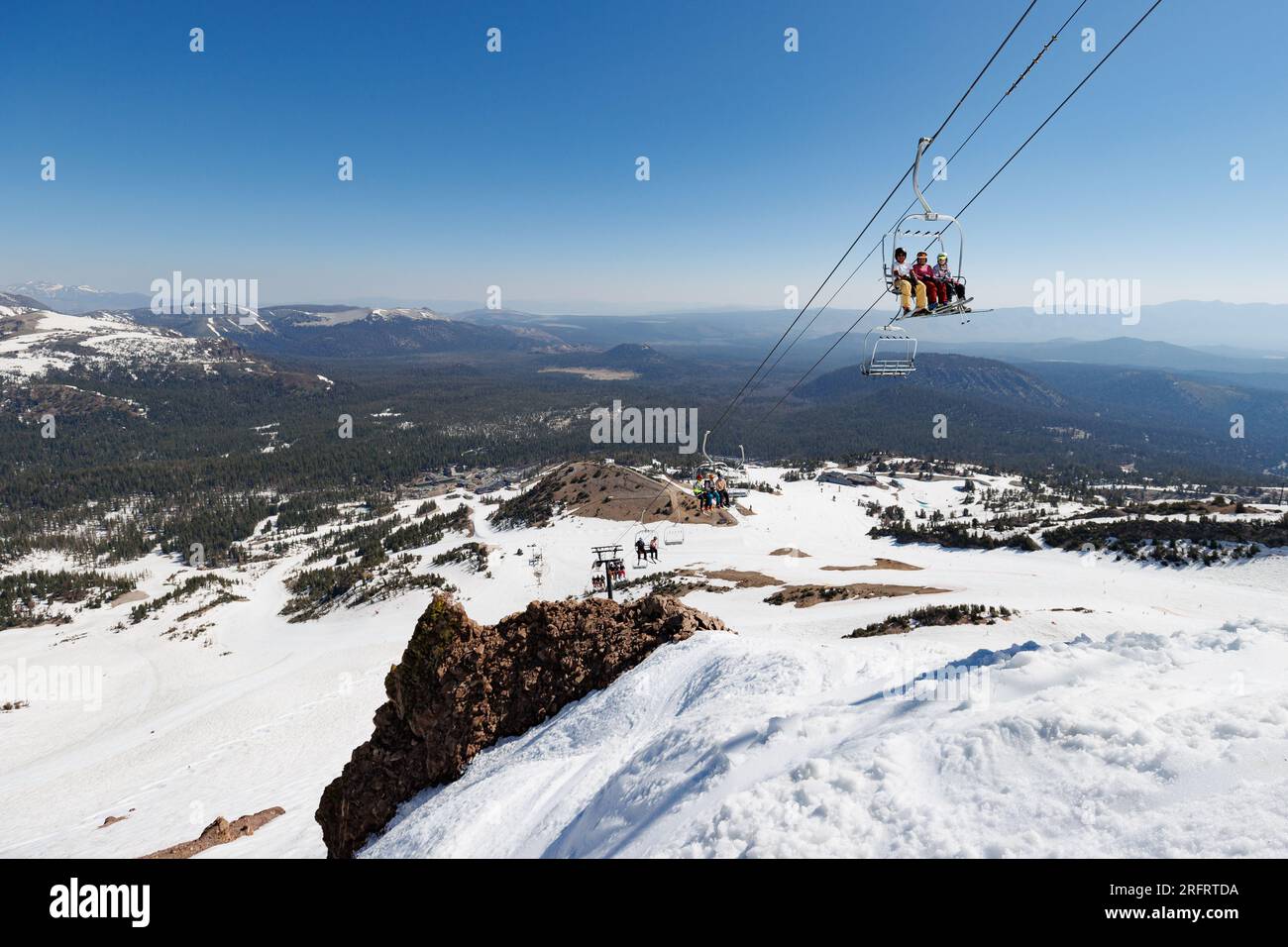 Mammoth Lakes, CA. July 4, 2023. People enjoying snow sports at Mammoth Mountain Ski Resort on a clear summer day. Stock Photo