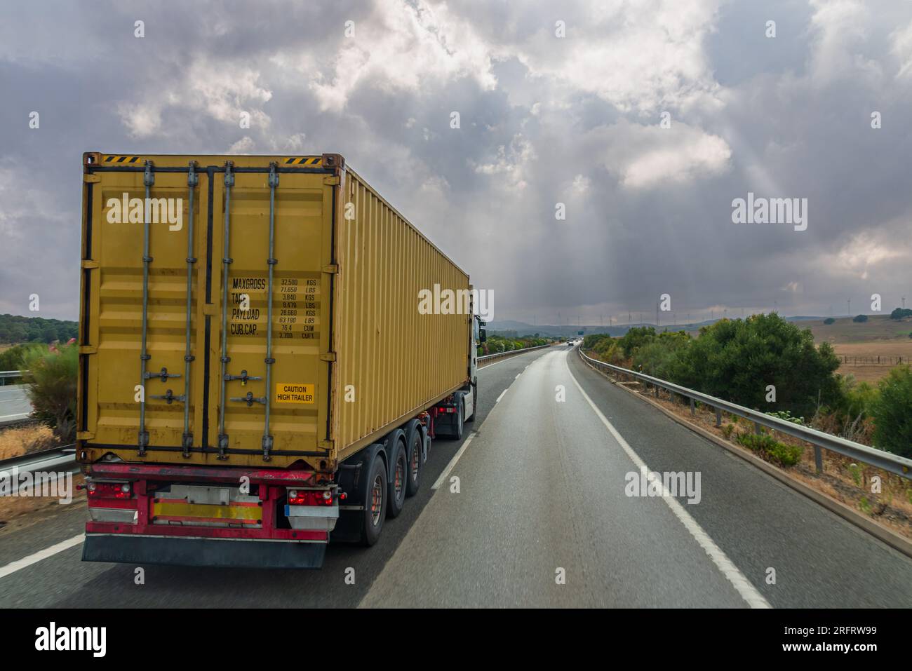 Truck with a container for intermodal transport driving on the highway