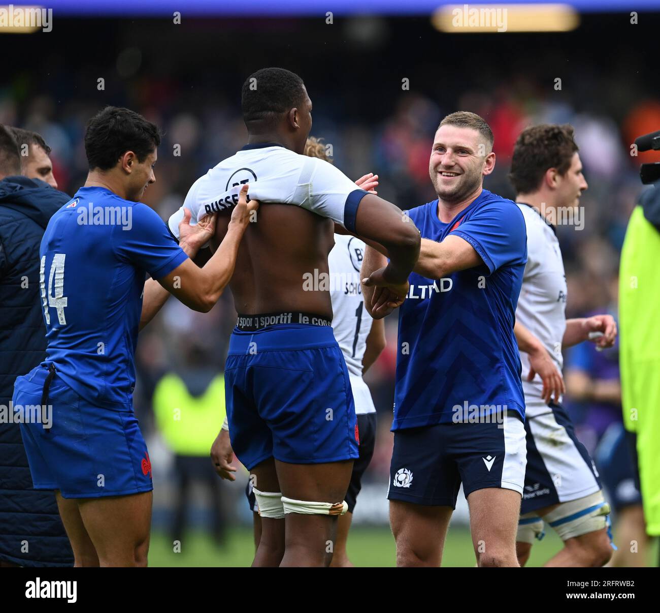 Scottish Gas Murrayfield.Edinburgh.Scotland, UK. 5th Aug, 2023. Scotland v France. The Famous Grouse Nations Series 2023. Scotlands10. Finn Russell (Bath Rugby) C Captain(R) swaps shirts with former Racing 92 team-mate 4 Cameron Woki - France lock with help from 14 Louis Bielle-Biarrey - France winger Credit: eric mccowat/Alamy Live News Stock Photo