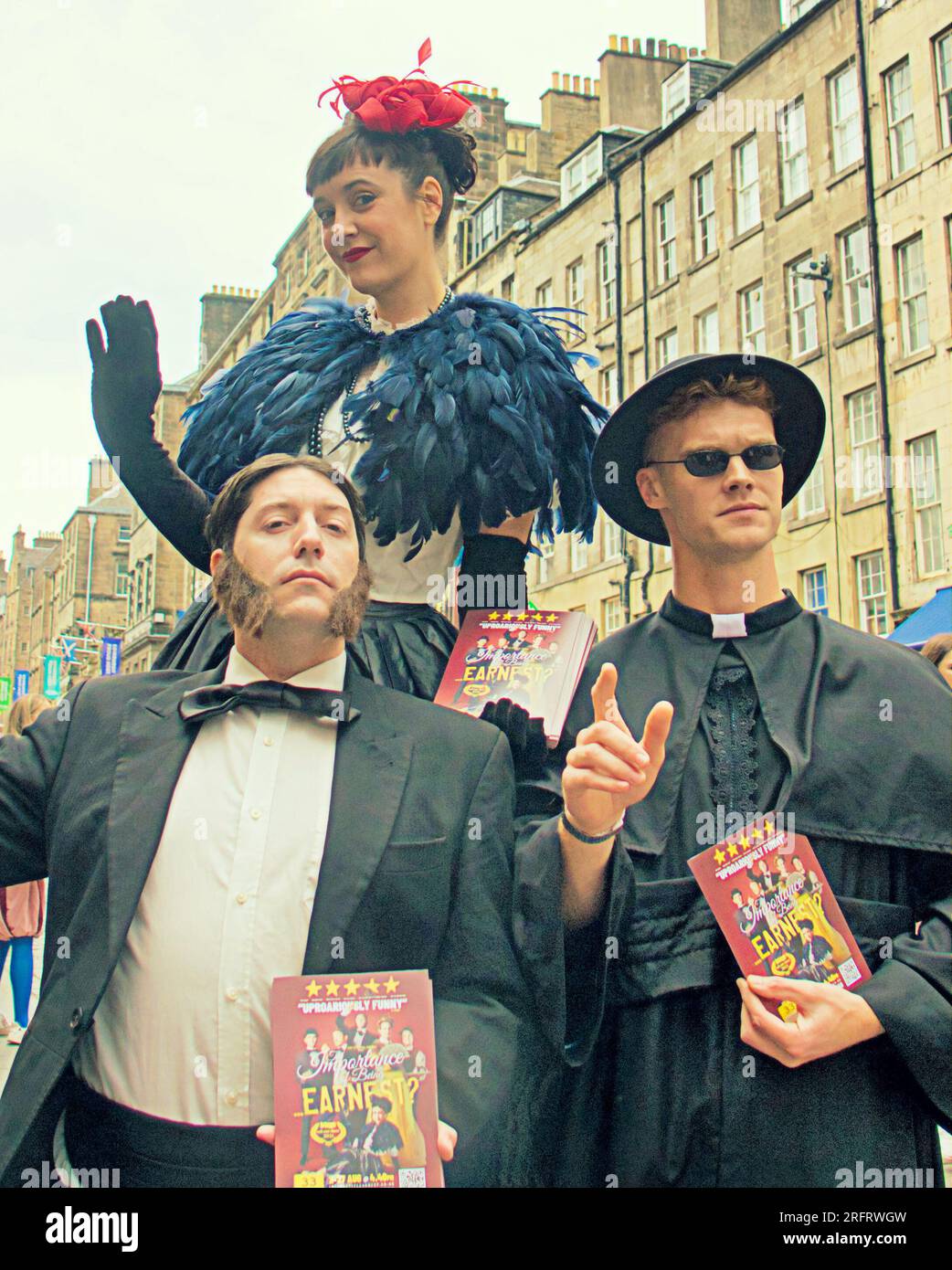 Edinburgh, Scotland, UK. 5th  August, 2023. the importance of being earnest  Edinburgh fringe performers from the importance of being earnest were out in force on the royal mile advertising their shows with flyers ahead of the rain appearing. Credit Gerard Ferry/Alamy Live News Stock Photo