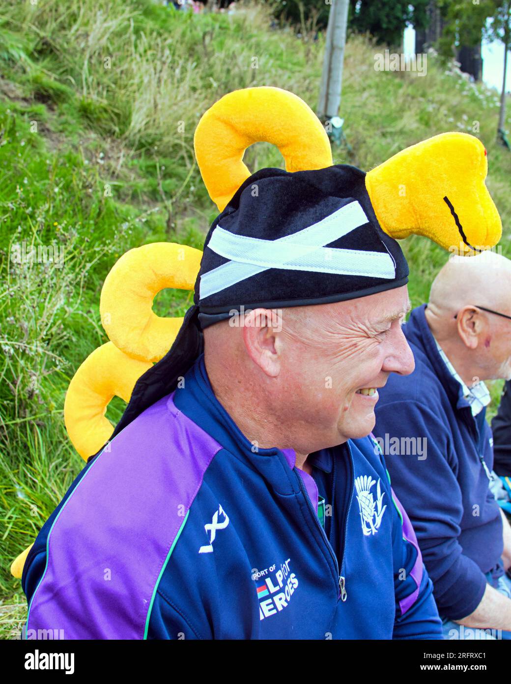 Edinburgh, Scotland, UK. 5th  August, 2023. nessie hat on rugby supporter  Edinburgh fringe performers were out in force on the royal mile advertising their shows with flyers ahead of the rain appearing. Credit Gerard Ferry/Alamy Live News Stock Photo