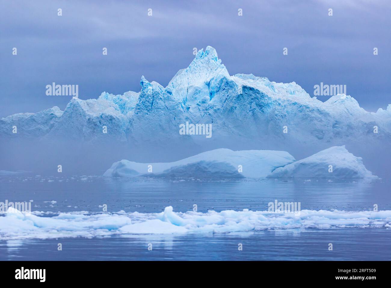 Giant icebergs in Disko Bay north of Arctic Circle, near Ilulissat Icefjord, Greenland Stock Photo