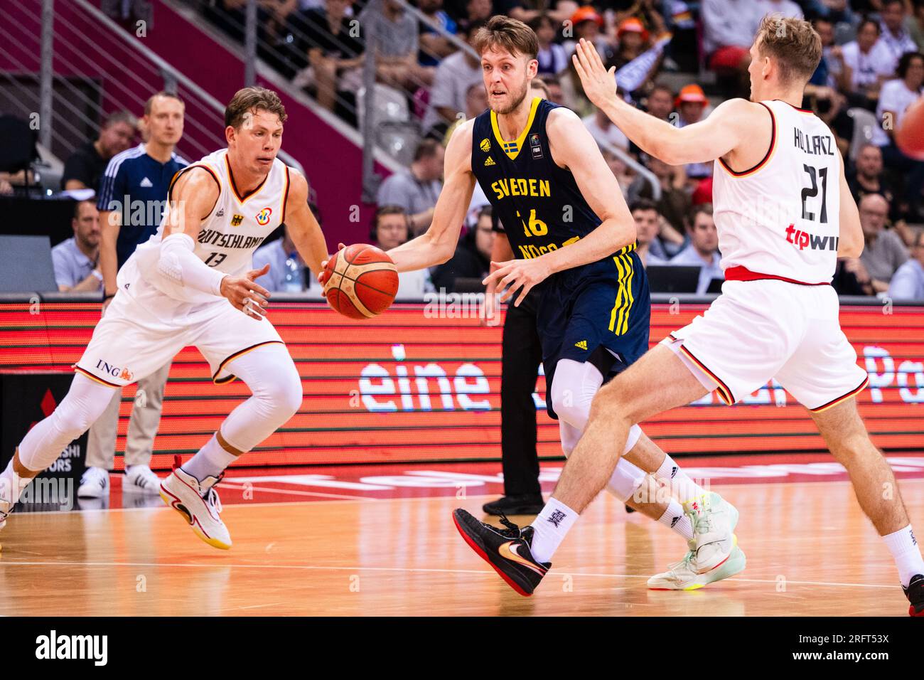 Bonn, Germany. 05th Aug, 2023. Basketball: International match, Germany - Sweden, Telekom Dome. Germany's Moritz Wagner (l) and Sweden's Nick Spires (m) fight for the ball. On the right, Germany's Justus Hollatz. Credit: Marius Becker/dpa/Alamy Live News Stock Photo