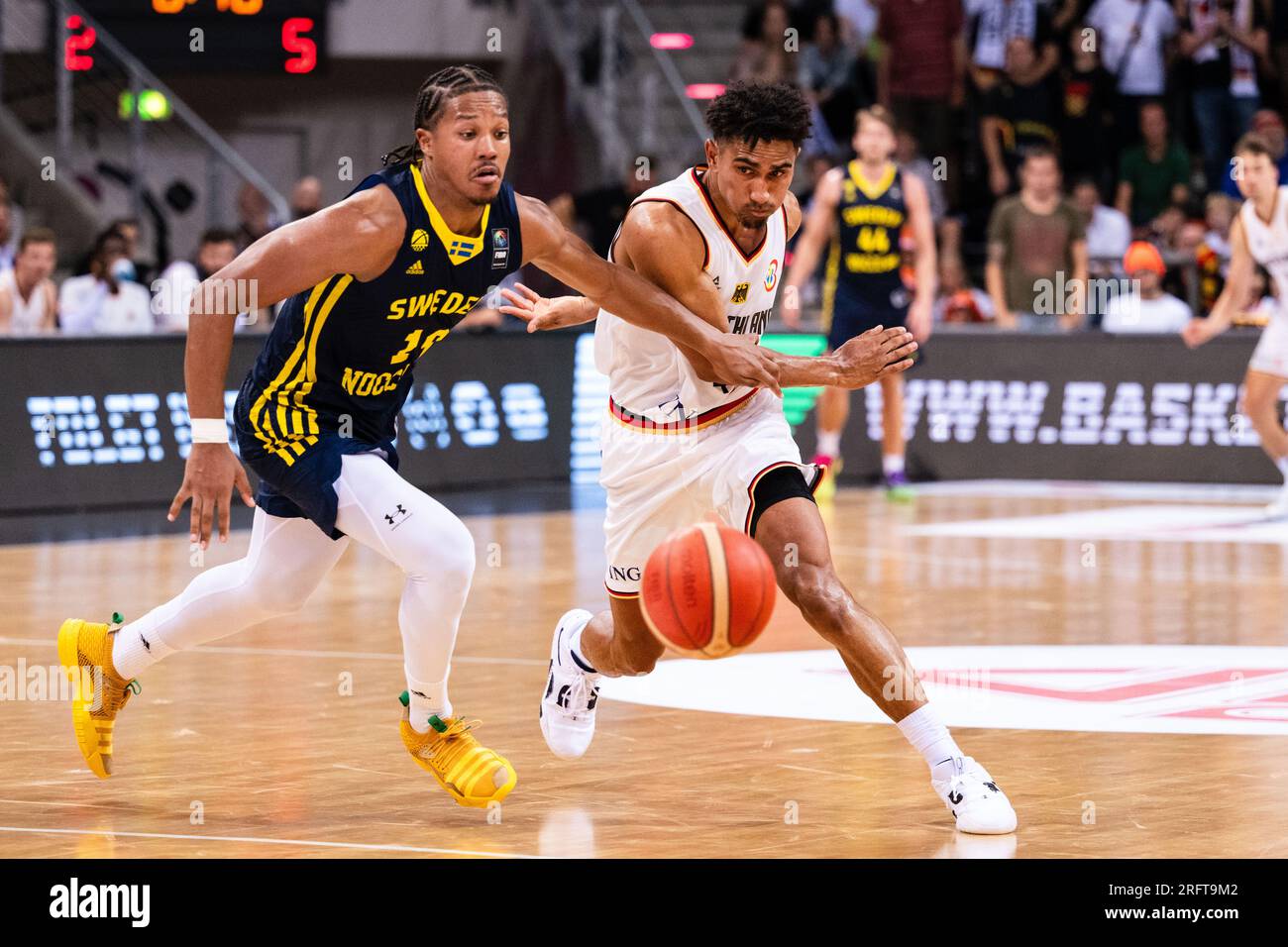 Bonn, Germany. 05th Aug, 2023. Basketball: International match, Germany - Sweden, Telekom Dome. Germany's Maodo Lo (right) and Sweden's Melwin Patzar fight for the ball. Credit: Marius Becker/dpa/Alamy Live News Stock Photo