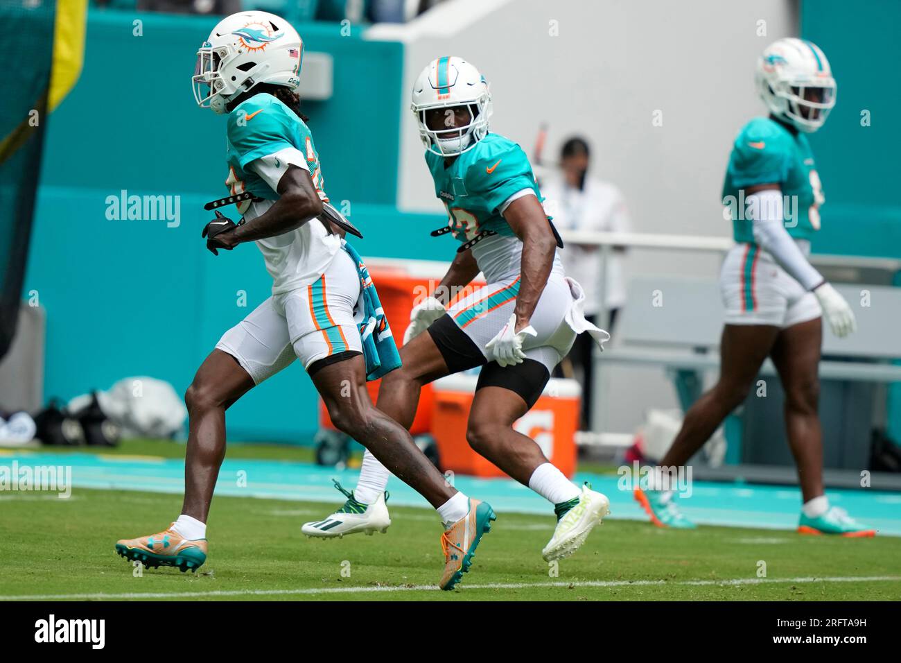 Miami Dolphins cornerbacks Cam Smith, left, and Eli Apple, right, do
