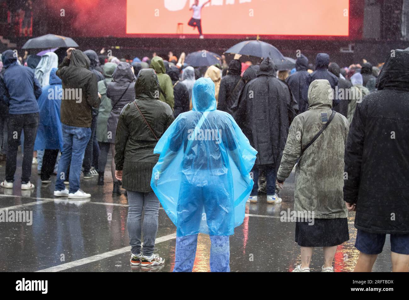 Rain poncho festival hi-res stock photography and images - Page 3 - Alamy