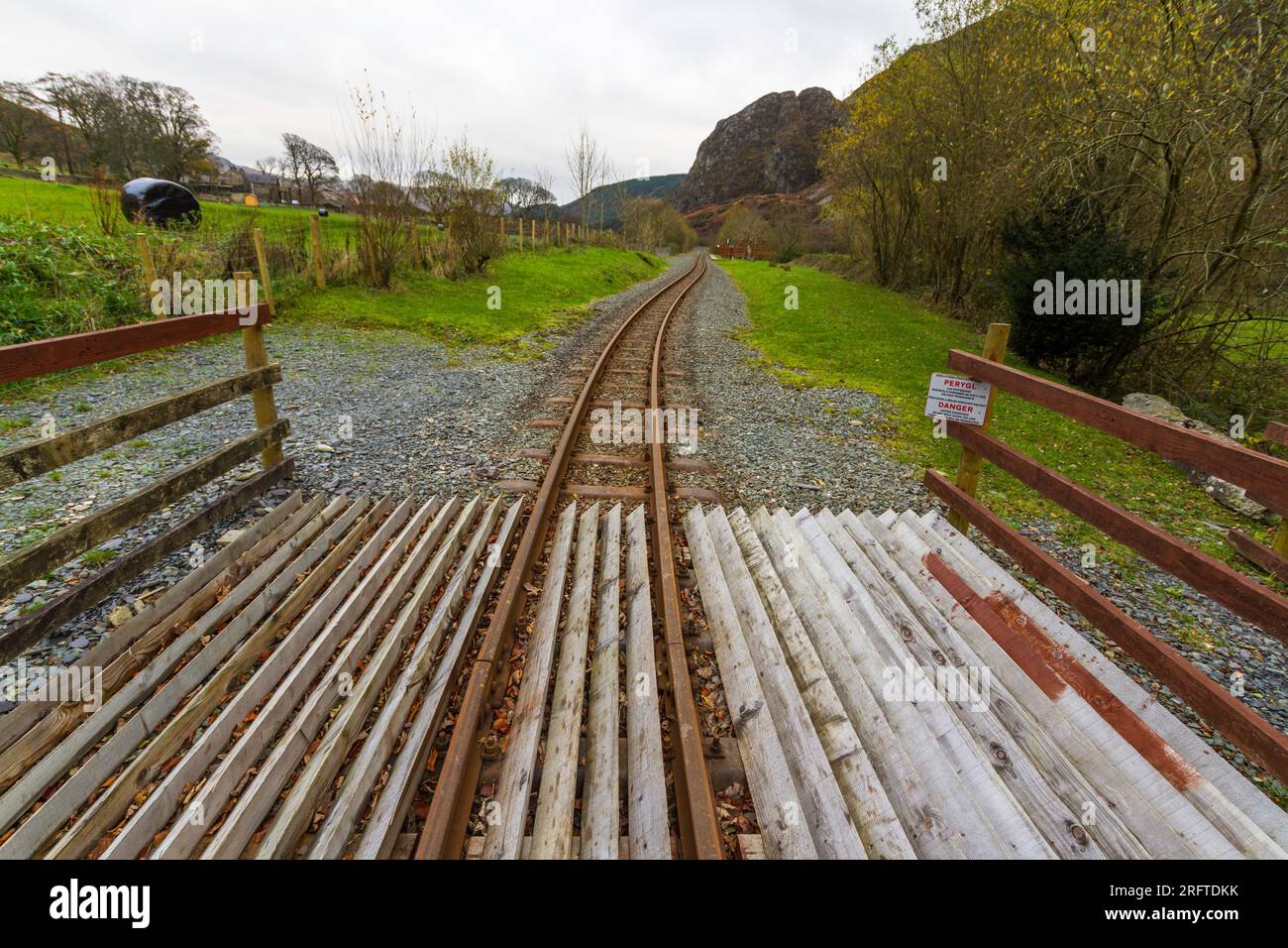 Narrow gauge Railway tracks at Plas-y-Nant station on the Welsh Highland Railway. Betws Garmon, Snowdonia or Eryri, North Wales, landscape. Stock Photo