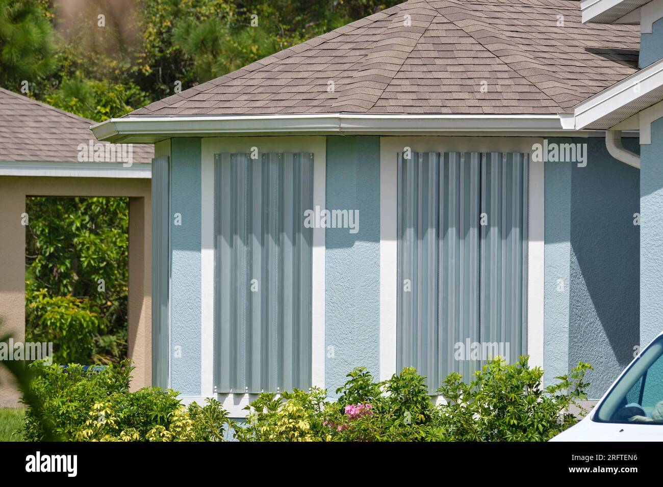 Hurricane shutters made from steel mounted for protection of house