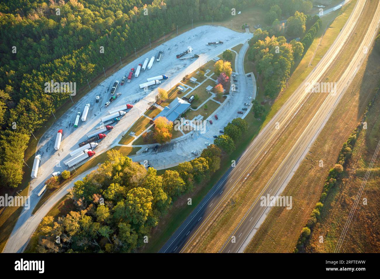 Large truck stop with resting area near busy american interstate 