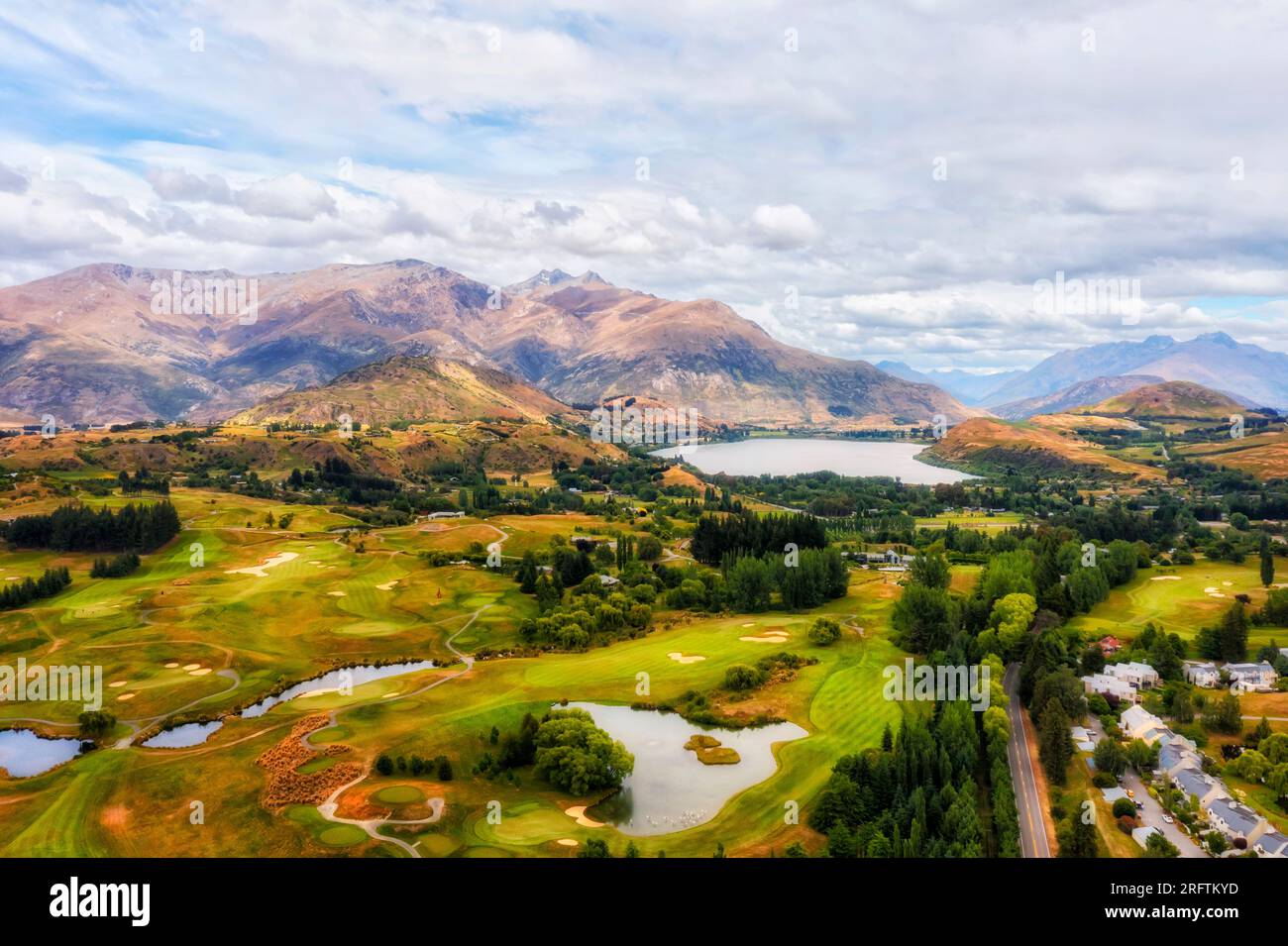 Arrowtown town in New Zealand near Queenstown in scenic mountain region with valleys and lake Hayes. Stock Photo