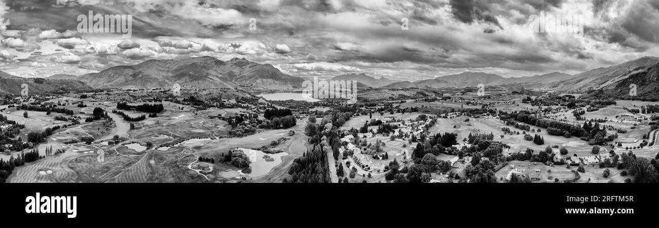 Dramatic arrowtown town in scenic vale of New Zealand South Island at Lake Hayes near QUeenstown- aerial panorama. Stock Photo