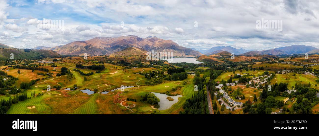 Arrowtown town in scenic vale of New Zealand South Island at Lake Hayes near QUeenstown- aerial panorama. Stock Photo