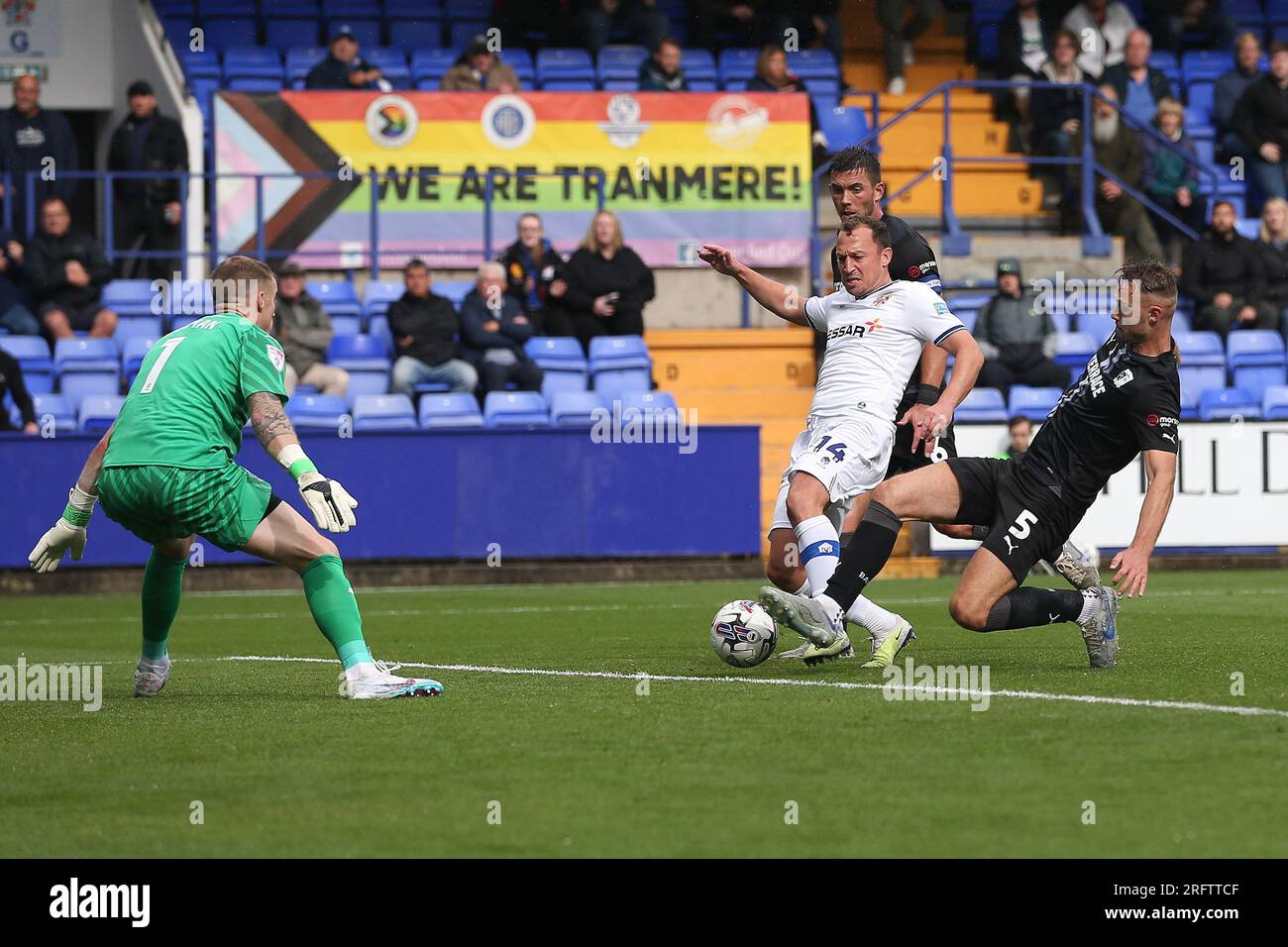 Birkenhead, UK. 05th Aug, 2023. George Ray of Barrow (5) gets to the ball as Kristian Dennis of Tranmere Rovers was about to shoot. EFL Skybet Football league two match, Tranmere Rovers v Barrow AFC at Prenton Park, Birkenhead, Wirral on Saturday 5th August 2023. this image may only be used for Editorial purposes. Editorial use only, .pic by Chris Stading/ Credit: Andrew Orchard sports photography/Alamy Live News Stock Photo