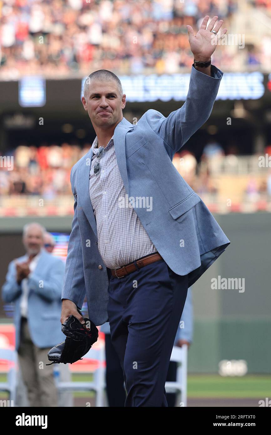 Former Minnesota Twins player Joe Mauer waves to fans after being