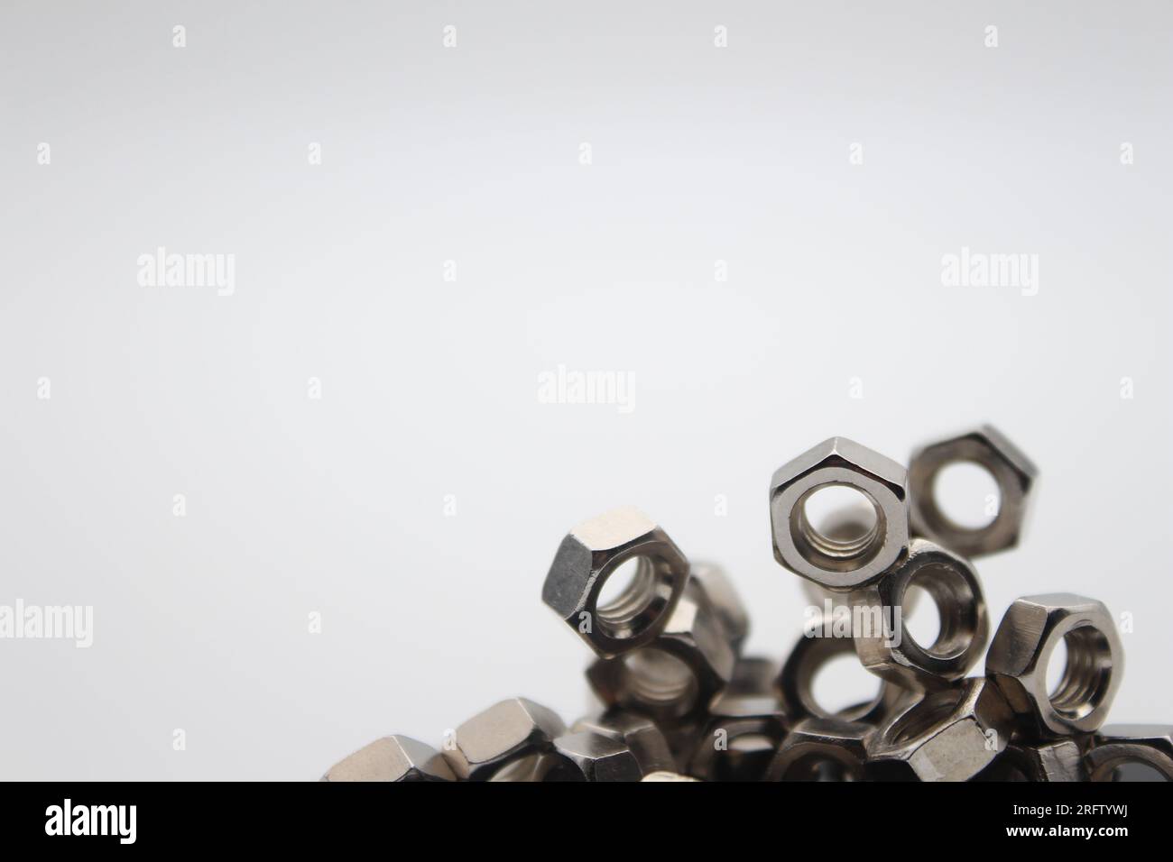 Many nuts touching each other with white background and text area Stock Photo